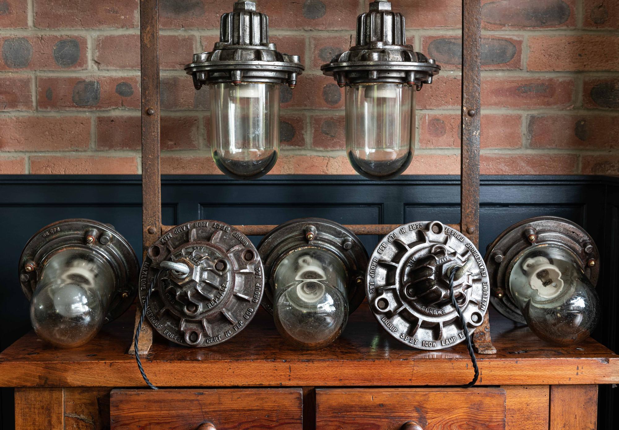 Mid-20th Century English Polished Cast Iron Factory 'Maxlume' Flameproof Pendants, circa 1950