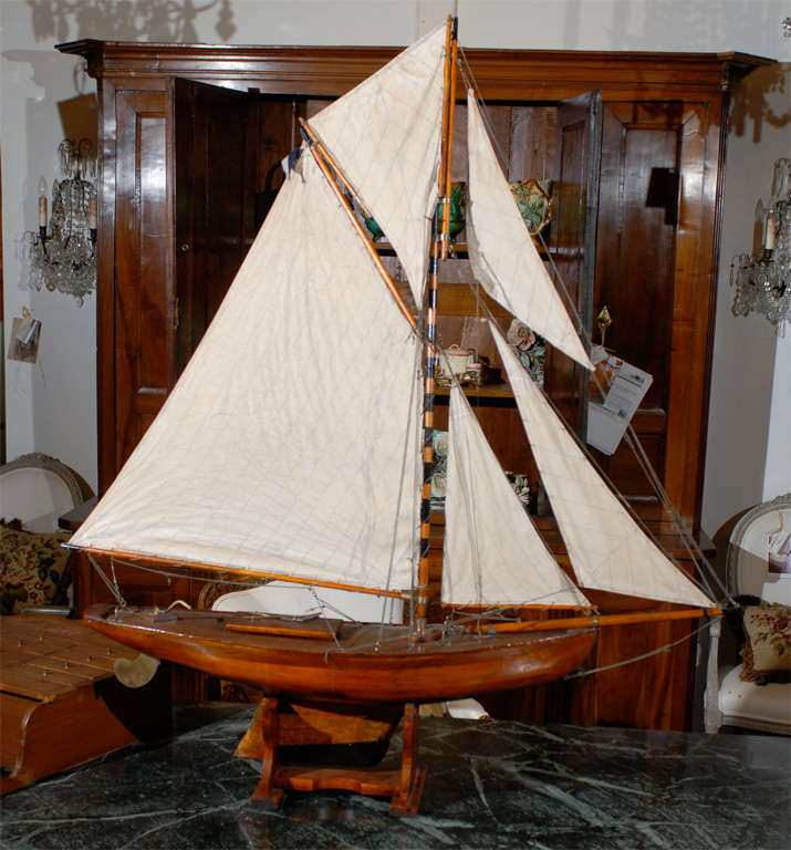 19th century English pond yacht on stand. This item is an antique and is one of a kind.