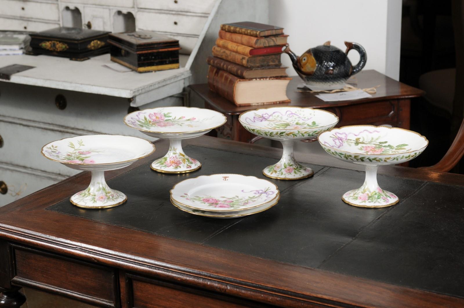 English porcelain compotes and plates from the 20th century, with floral décor and gilded trim, priced and sold $275 individually. Attracting our attention with their lovely silhouettes and delicate décor, each of these serving pieces features a