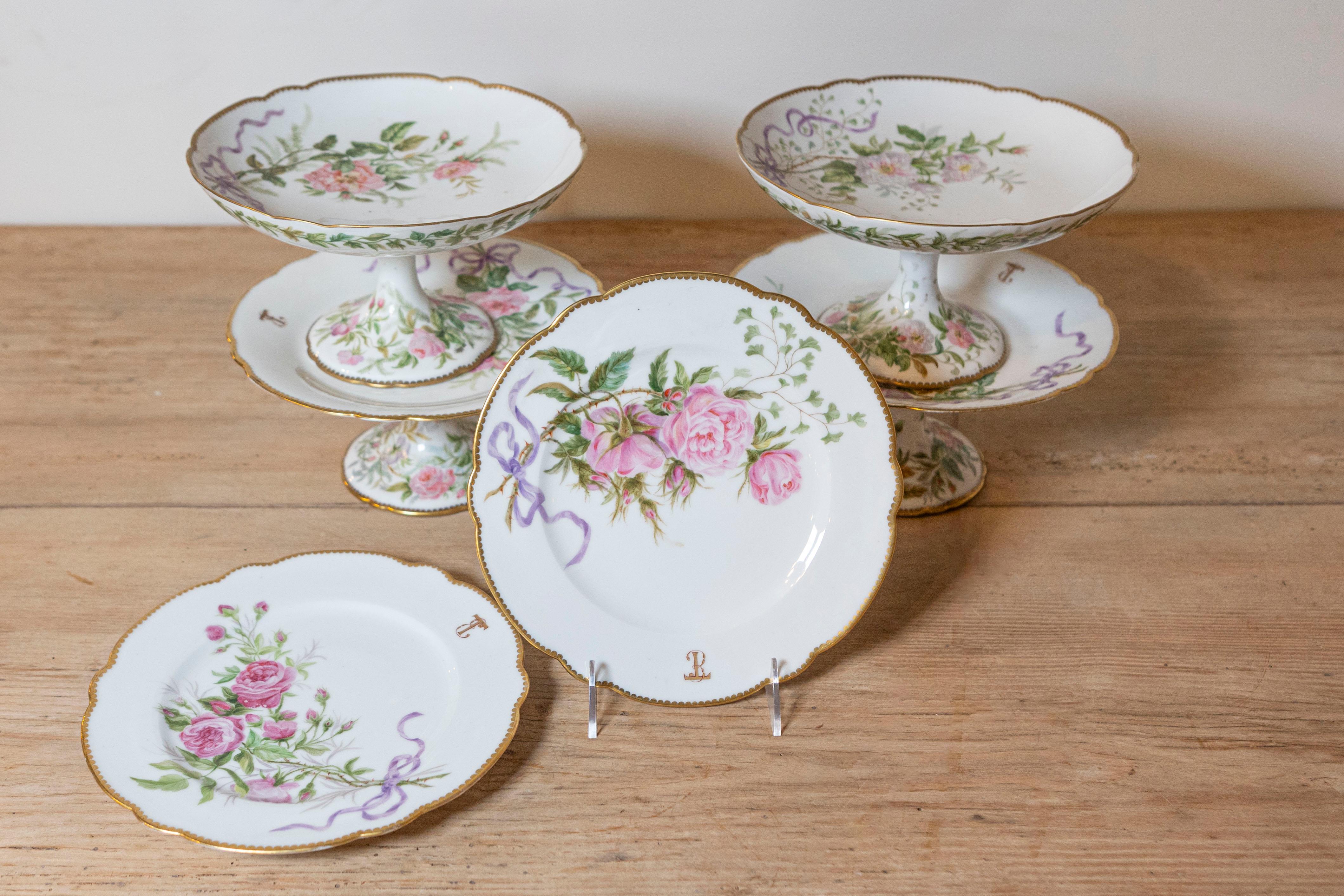English porcelain compotes and plates from the 20th century, with floral décor and gilded trim, priced and sold $275 individually. Attracting our attention with their lovely silhouettes and delicate décor, each of these serving pieces features a