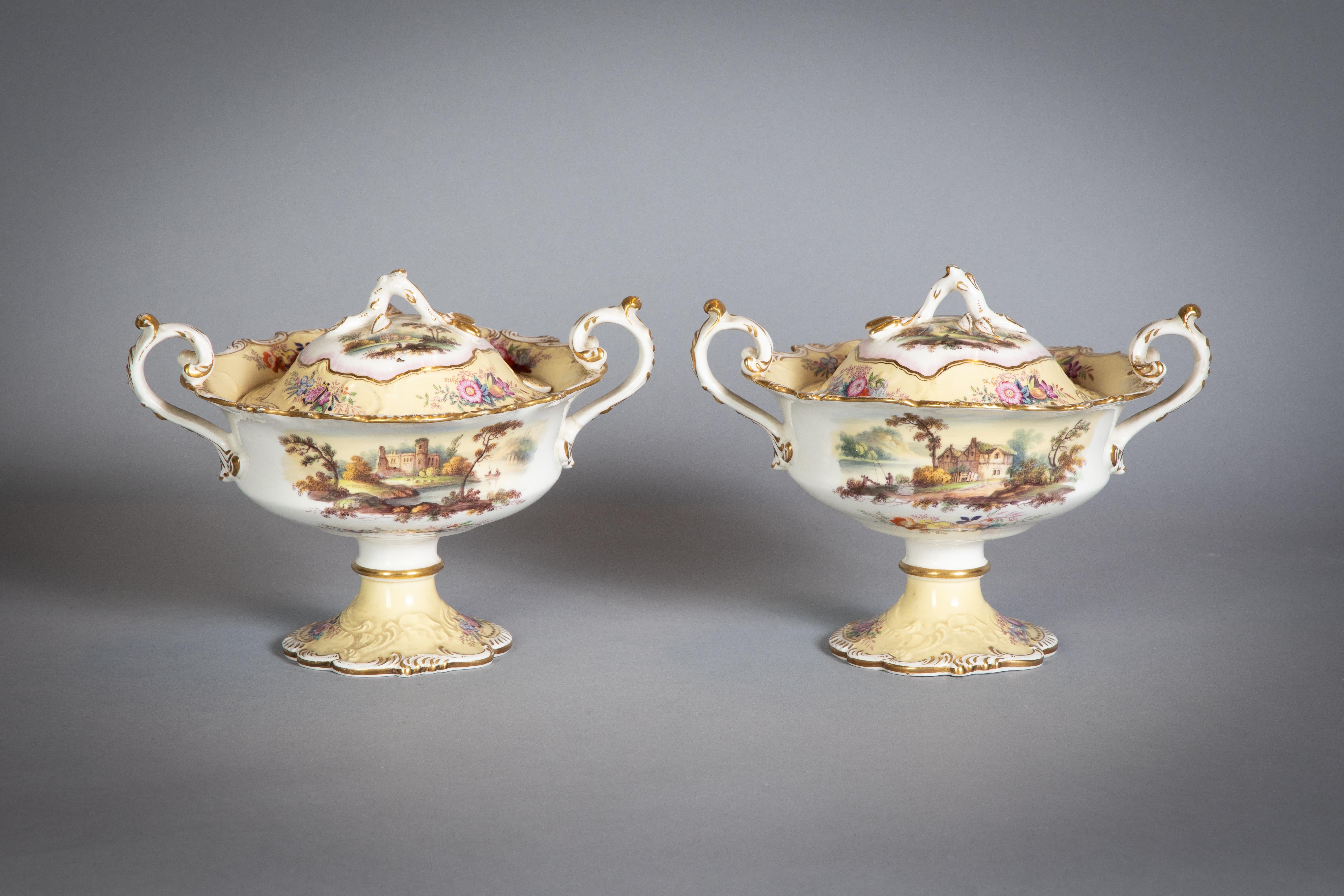 Each piece finely decorated with a different landscapre, the yellow ground border with floral arrangments in compartments, Comprising 1 compote, pair of covered sauce tureens, 16 plates.
