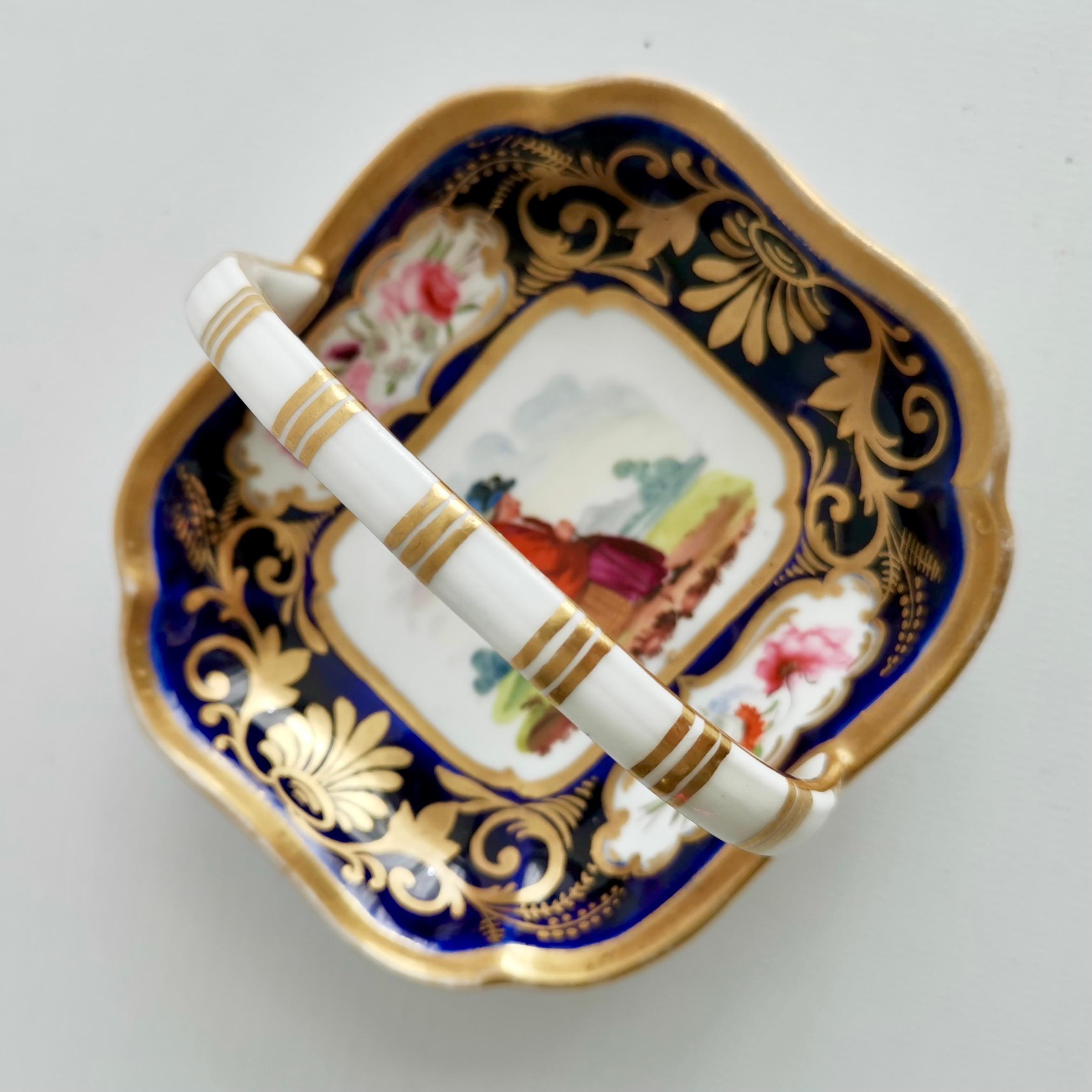 This is a gorgeous little porcelain basket or trinket dish made in England in around 1820. We don't know who made this basket: it could be James & Ralph Clews, who were known to paint these rustic figures, or Hicks & Meigh, or Ridgway, or frankly
