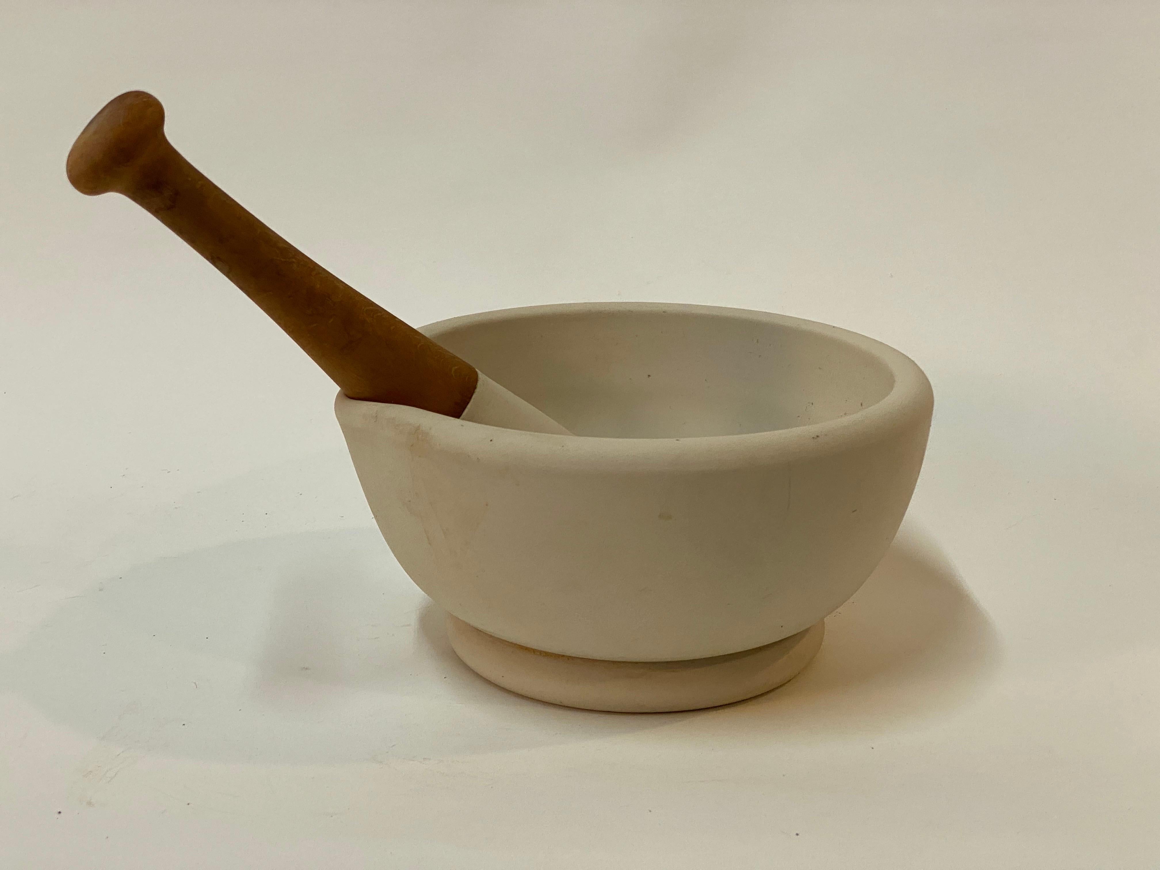 Porcelain mortar and pestle. Signed on the underside with the size #7, Acid Proof, Made in England. Wood handled pestle. Great for use in the kitchen, artist's studio or office. It doesn't matter whether you're grinding spices and herbs or artist's