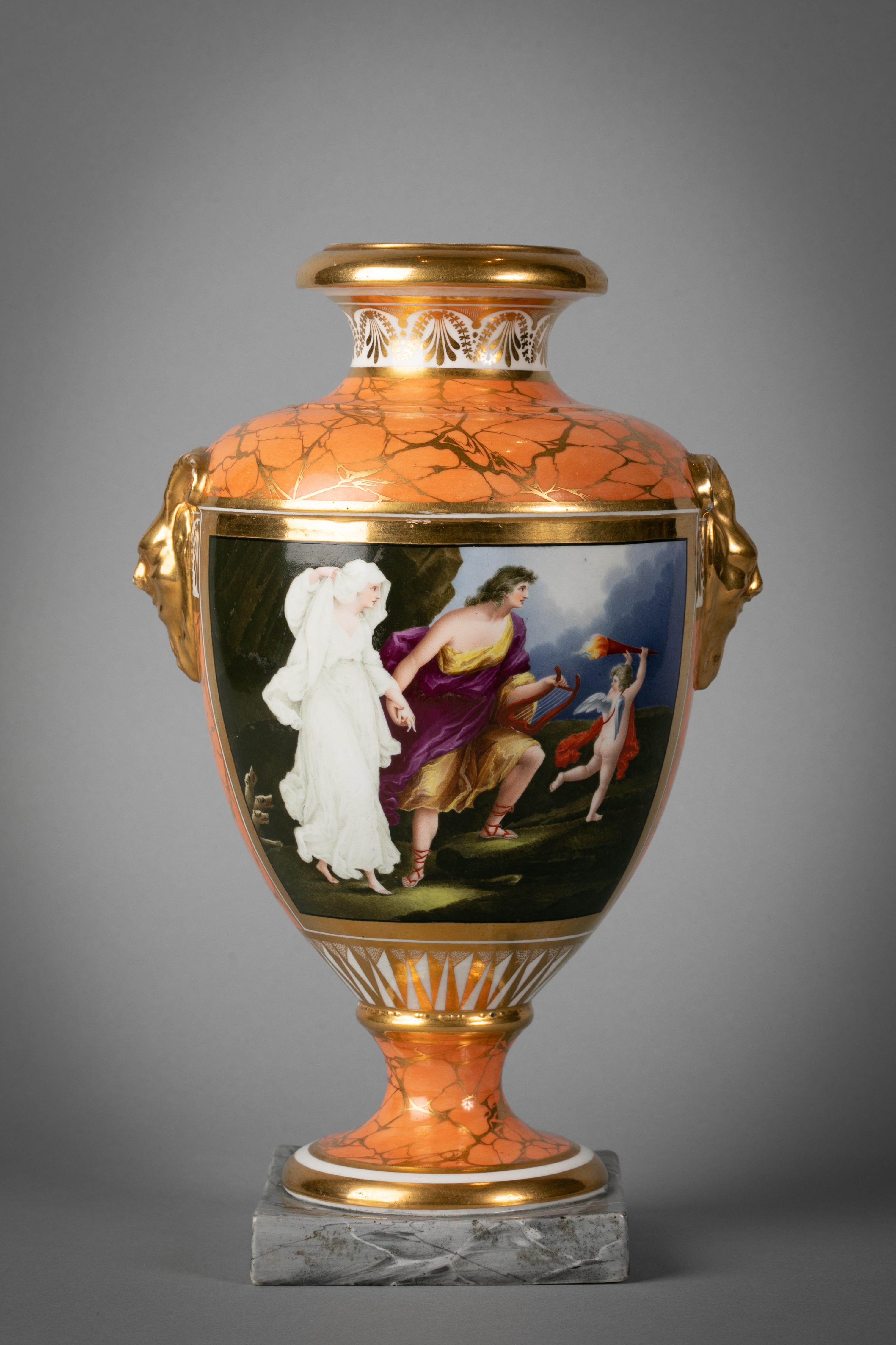 The ovoid body with moulded and gilt horned mask handles, painted in colors on one side with a large panel of ‘Orpheus and Euridice’, above a pedestal foot with grey marbled base with later replacement cover, painted title Orpheus & Euridice and