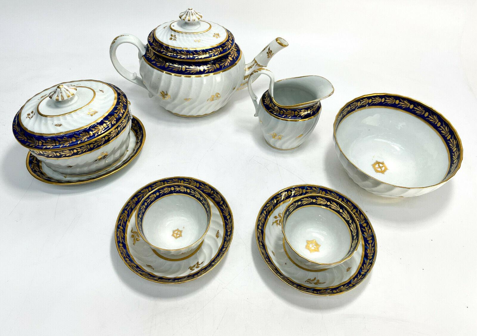 English Porcelain Tete-a-Tete Tea Service, Cobalt Blue & Gilt, Early 19th Cent

Swirled ribbed texture with cobalt blue and gilt leaf designs to the rim. Unmarked.

Additional Information:
Model: Tete-a-Tete Tea 
Material: Porcelain
Type: Tea