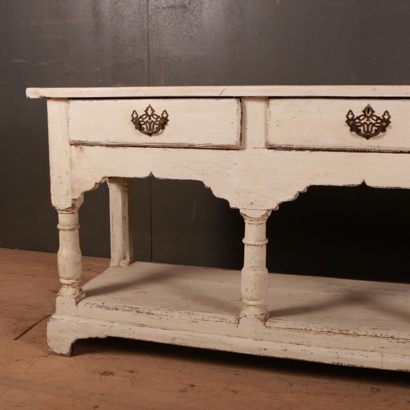 Late 18th century English painted 3-drawer Potboard dresser base with a sycamore top, 1790


Dimensions:
71 inches (180 cms) wide
18 inches (46 cms) deep
30.5 inches (77 cms) high.
             