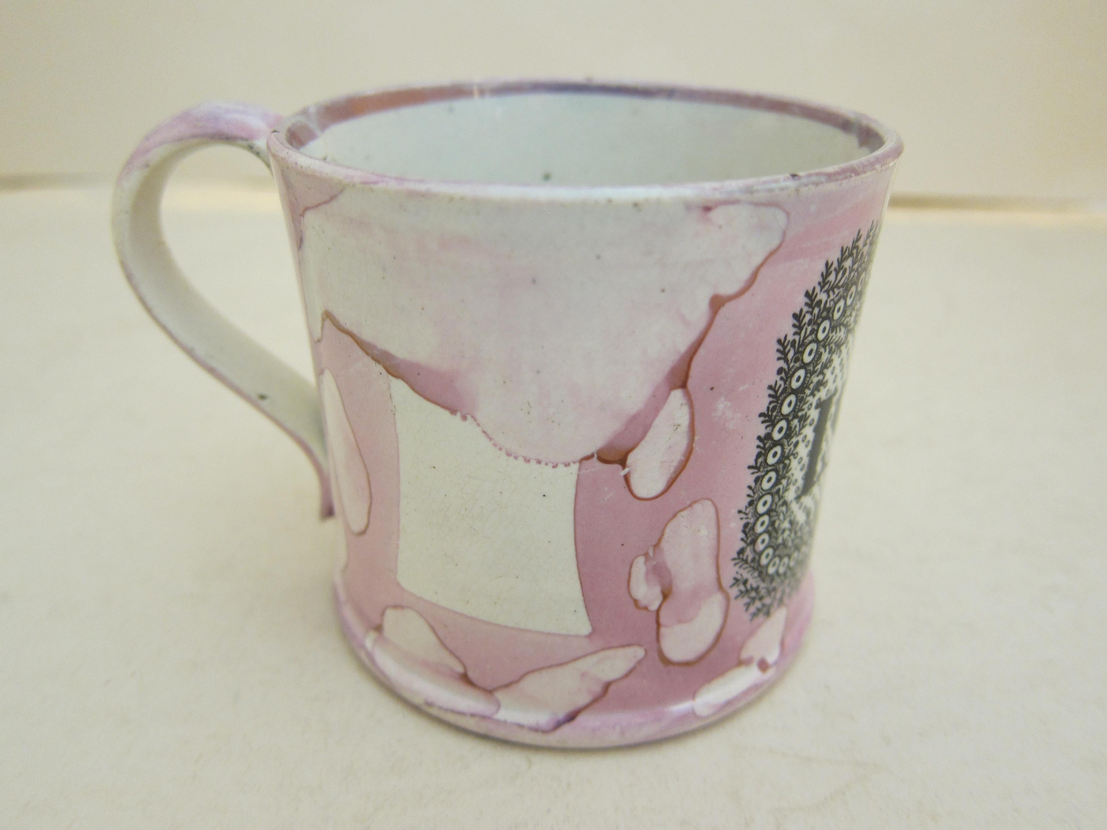 An English pottery Christening mug for Issac decorated with a black print and pink lustre.