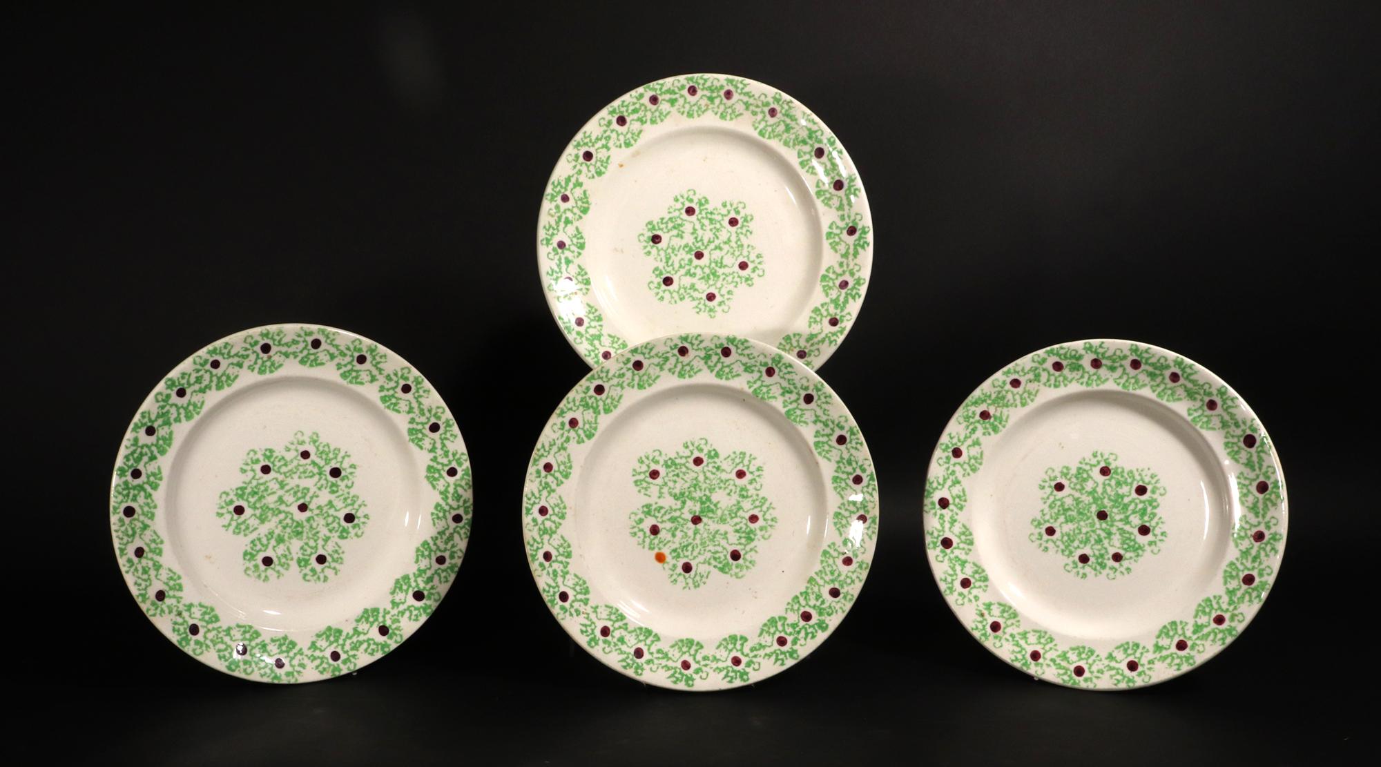 English Pottery Green Sponged Spatterware Set of Four Plates,
1st Half of 19th Century

The Sponged Spatterware plates are attractively decorated with a green seaweed border with a brown dot in the center of each stamp.  The design is found in the