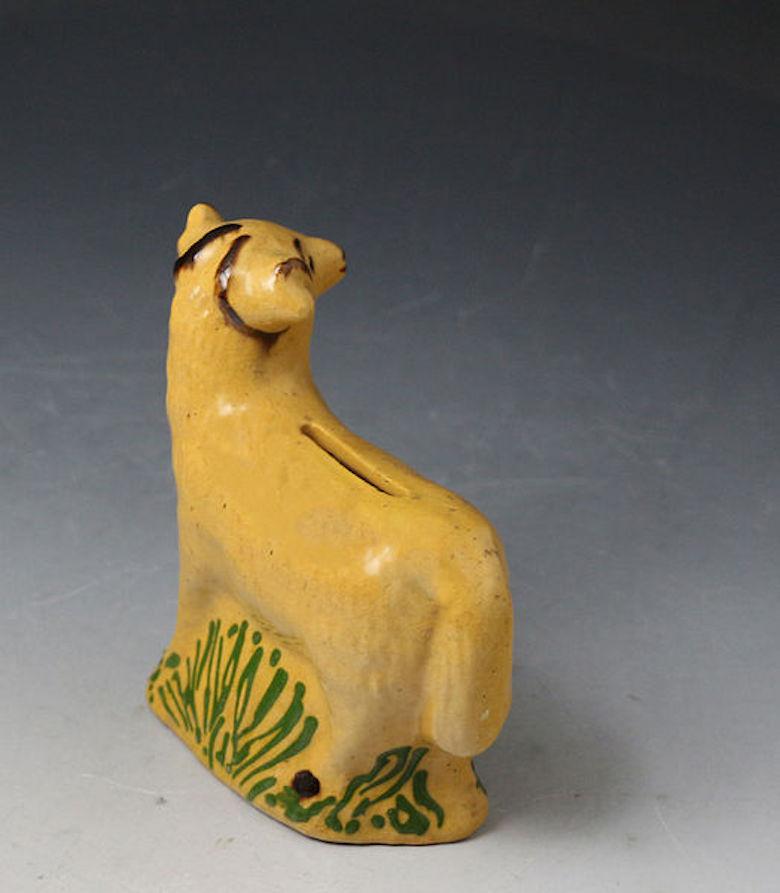 English Pottery Figure of a Ram in the Form of a Money Box Early 19th Century In Good Condition For Sale In Woodstock, OXFORDSHIRE