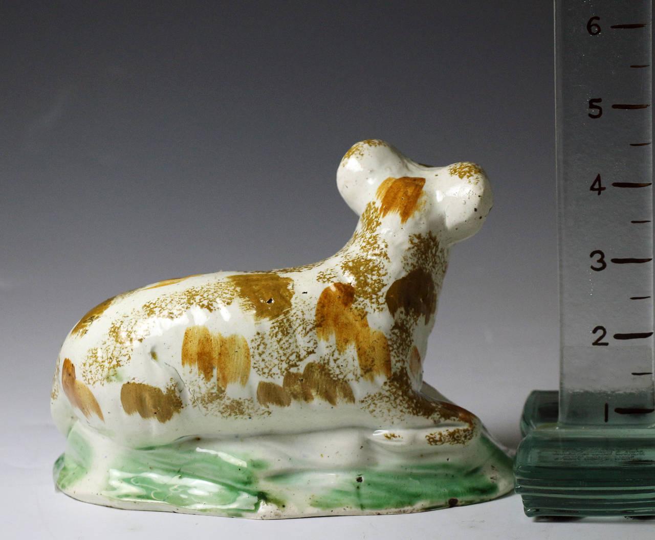Pottery figure of a ram antique period in Prattware colours and modeled in the Ralph Wood style.