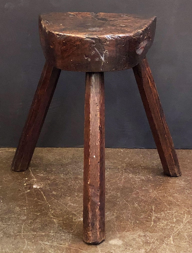 A handsome Primitive or rustic three-legged milking stool from England, of finely patinated oak - Makes a great side or occasional table.
