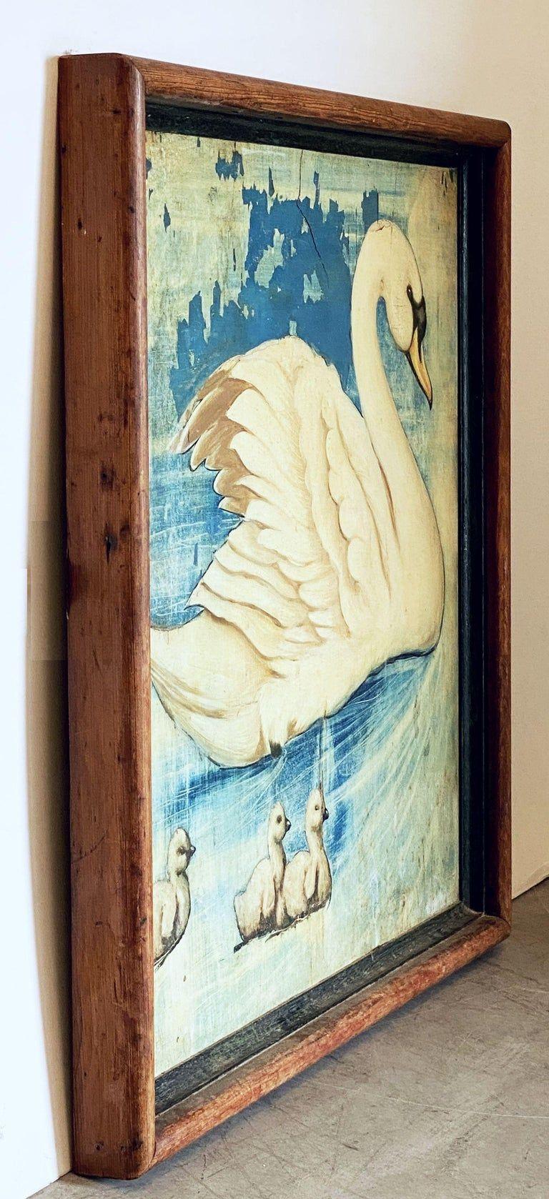 An authentic English pub sign (one-sided) featuring a painting of a swan with three cygnets, untitled.

A very fine example of vintage advertising artwork and ready for display.