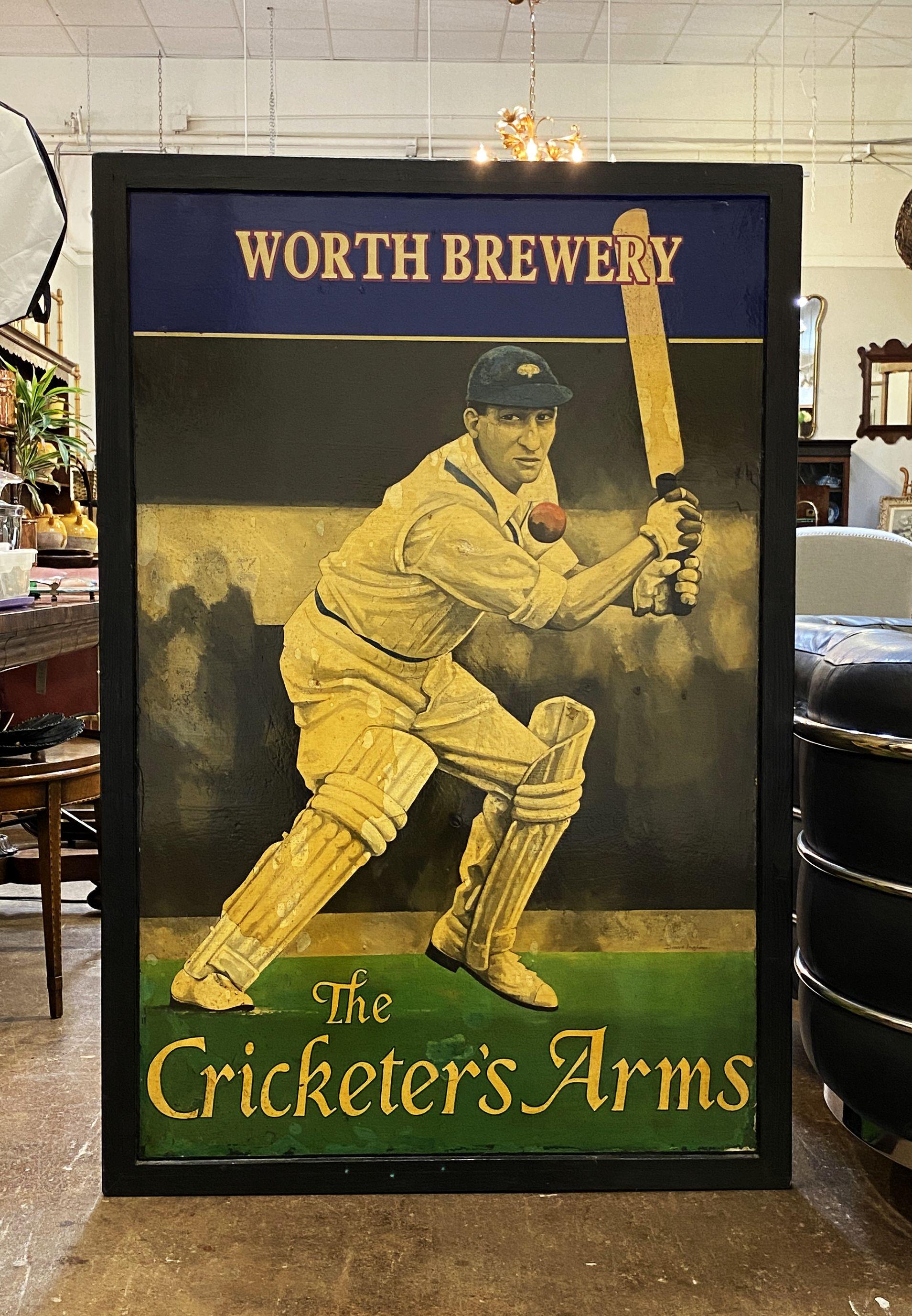 An authentic English pub sign (one-sided) featuring a painting of a cricket player with bat and ball, entitled: Worth Brewery - The Cricketer's Arms.

A very fine example of vintage advertising artwork, ready for display.

