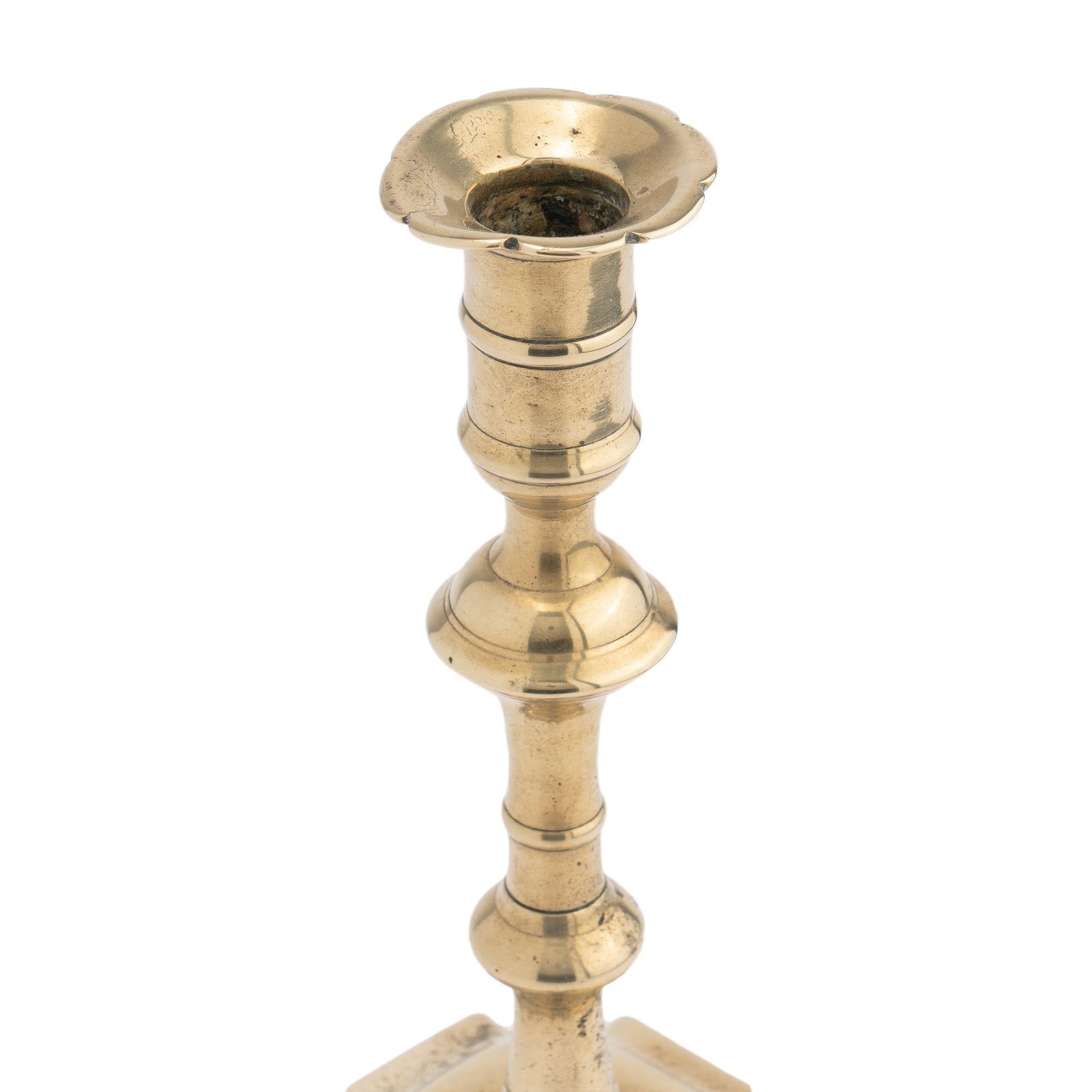 Brass English Queen Anne cast brass baluster shaft candlestick, 1740-60 For Sale