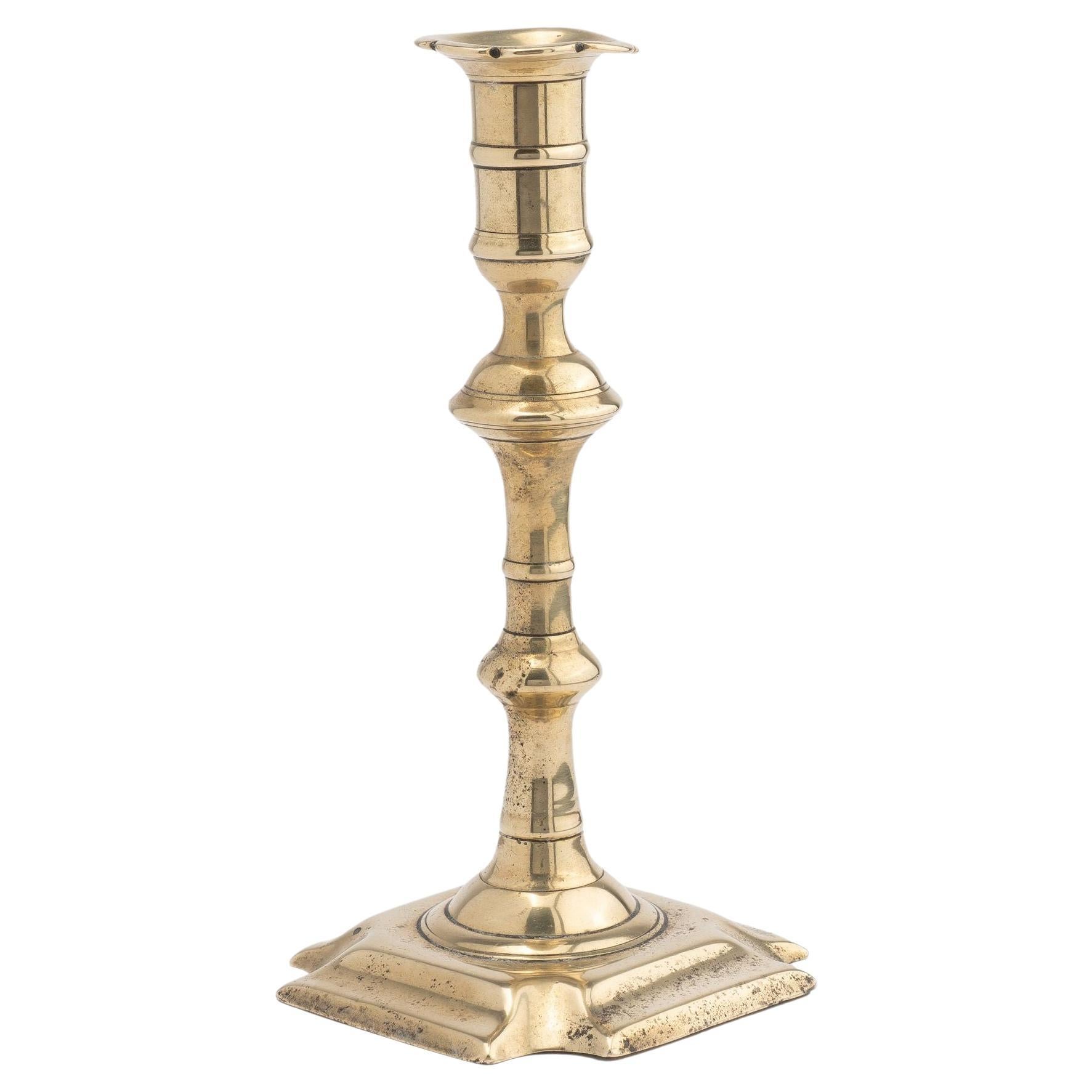 English Queen Anne cast brass baluster shaft candlestick, 1740-60 For Sale