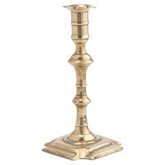 Antique English Queen Anne cast brass baluster shaft candlestick, 1740-60