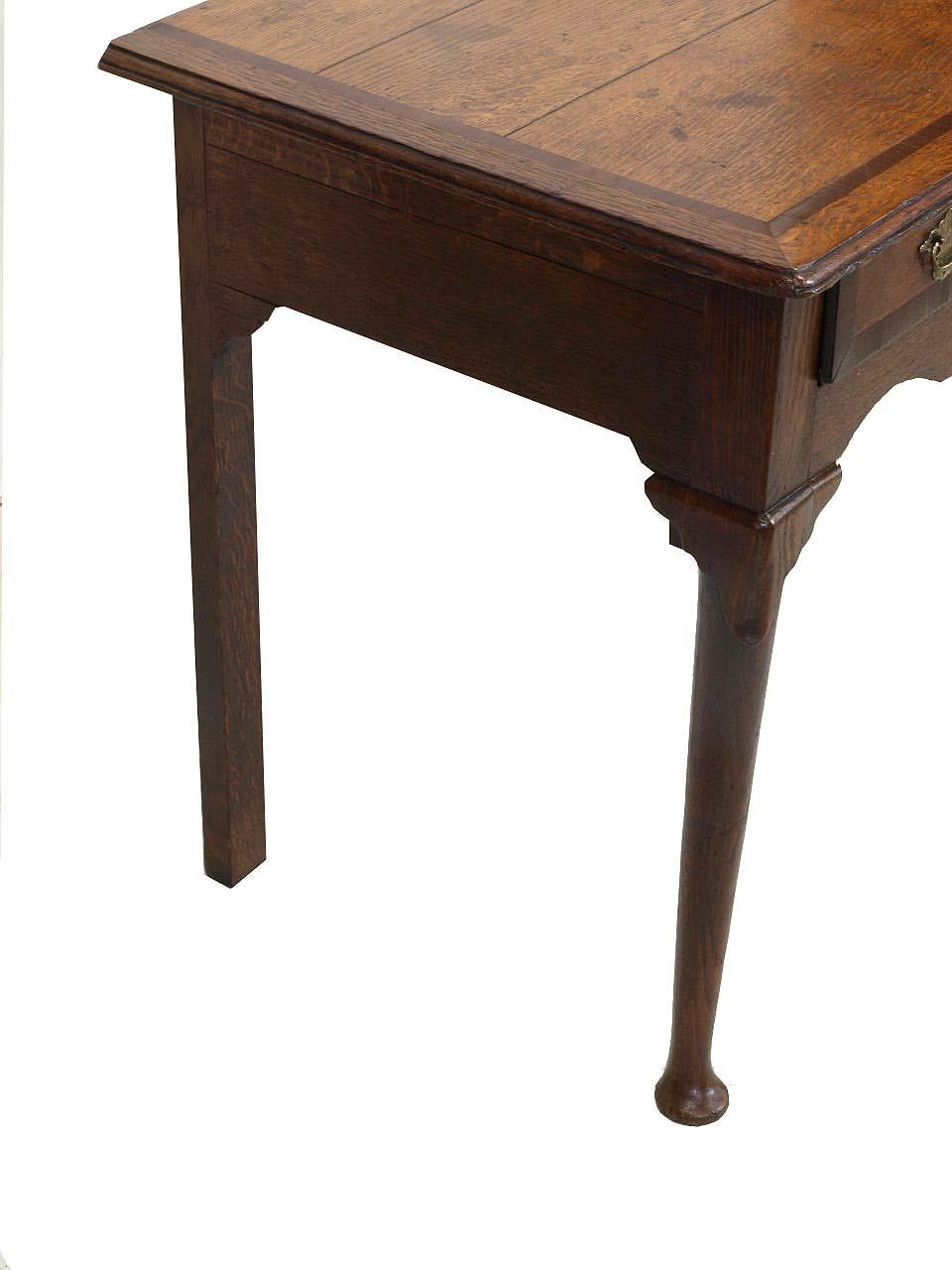 English Queen Anne oak lowboy, the top has''breadboard'' ends around the front perimeter followed by a band of mahogany. Note in the photos of the top, there are two minor shrinkage separations running parallel to each other which is quite common