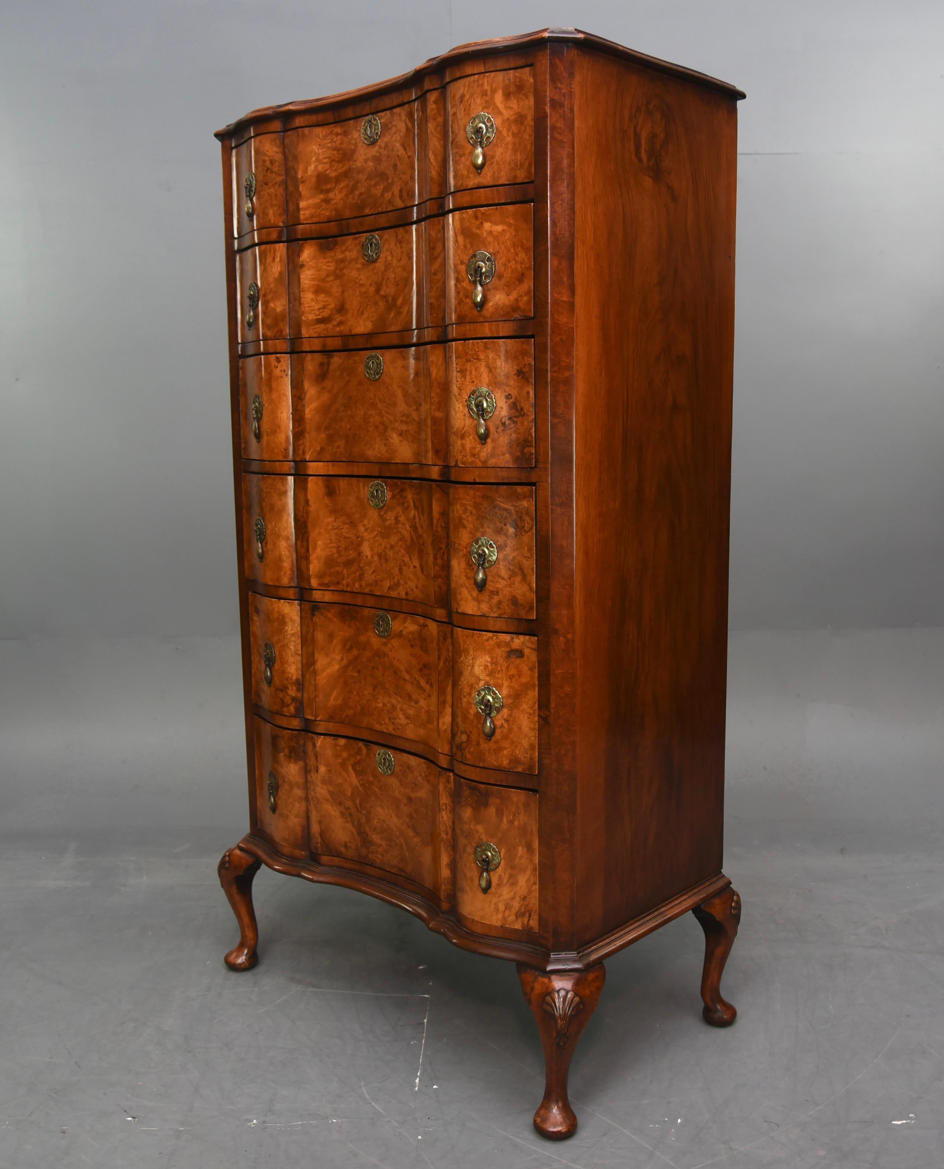 fine quality Edwardian burr walnut Queen Anne style six drawer tall boy.
The chest has six oak lined hand dovetailed drawers with a wonderful shape front and original brass drop handles.
The chest is a fabulous colour and has a very good