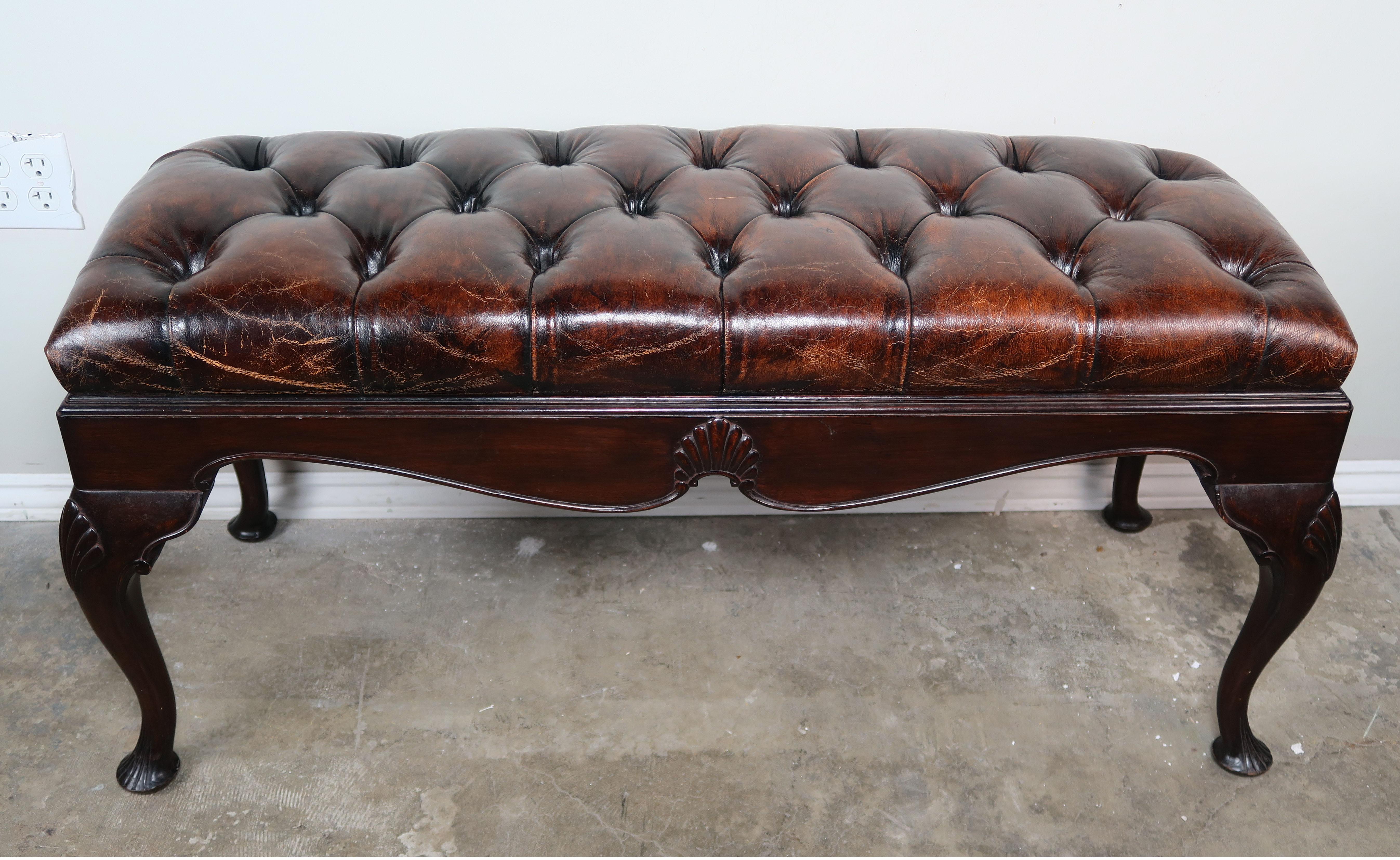 English Queen Anne style leather tufted bench, circa 1900. Beautiful chestnut colored leather.