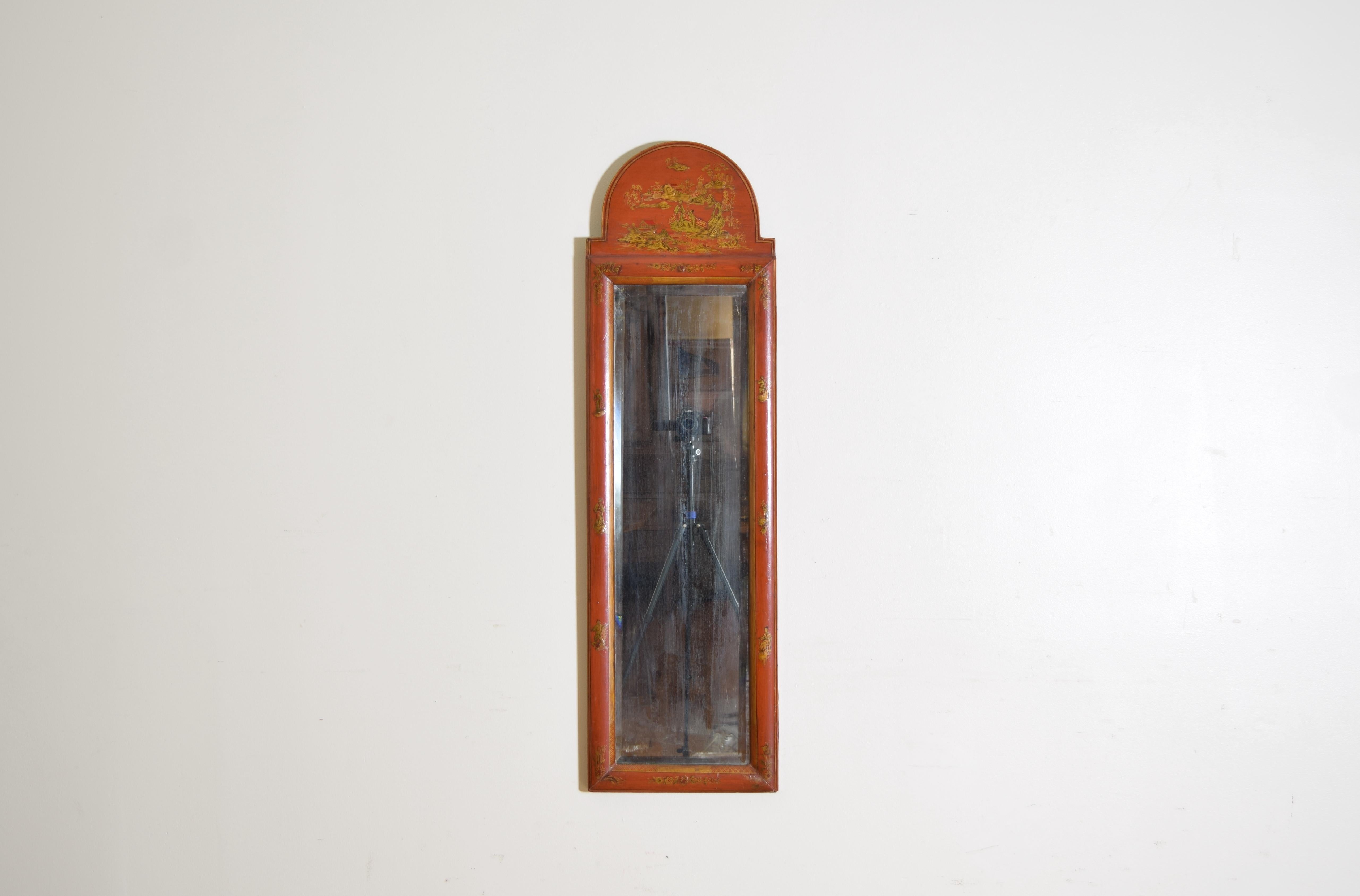 having an arched top with gilt figural and floral decoration, with beveled mirror plate