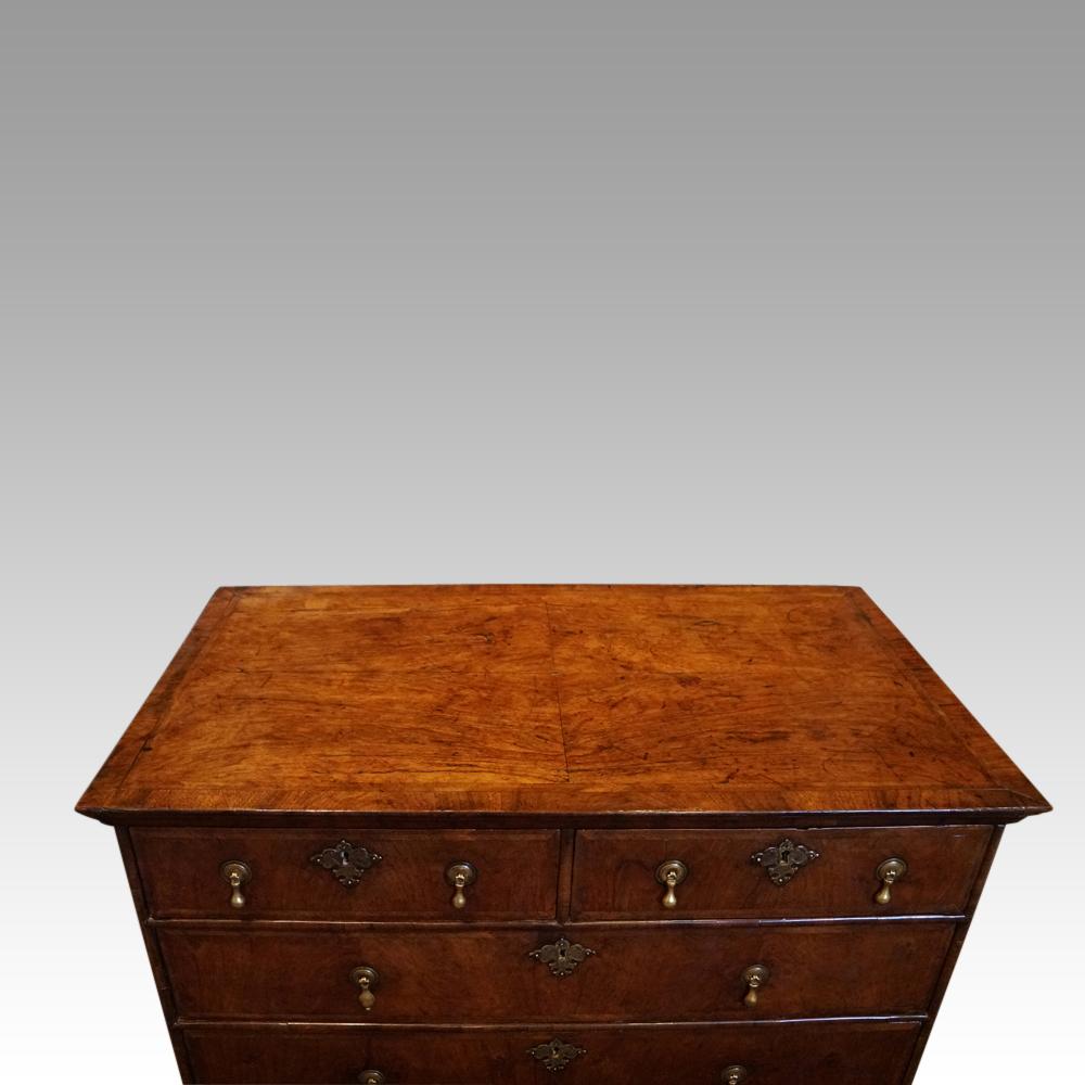 Queen Anne walnut chest of drawers
This Queen Anne walnut chest of drawers was made circa 1710.
Having lovely walnut with herringbone banding to the top and front and with oak sides.
Each drawer is fitted with brass pear drop handles that would