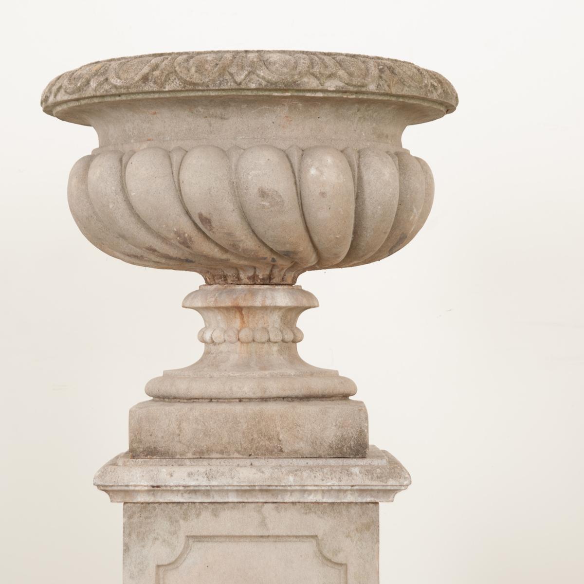 This large garden urn-on-pedestal is a smart way to elevate your outdoor space to the next level of sophistication. The stone garden urn breaks down into 5 pieces. The bowl, pedestal, square cap on top of the pedestal, rectangular pedestal and the