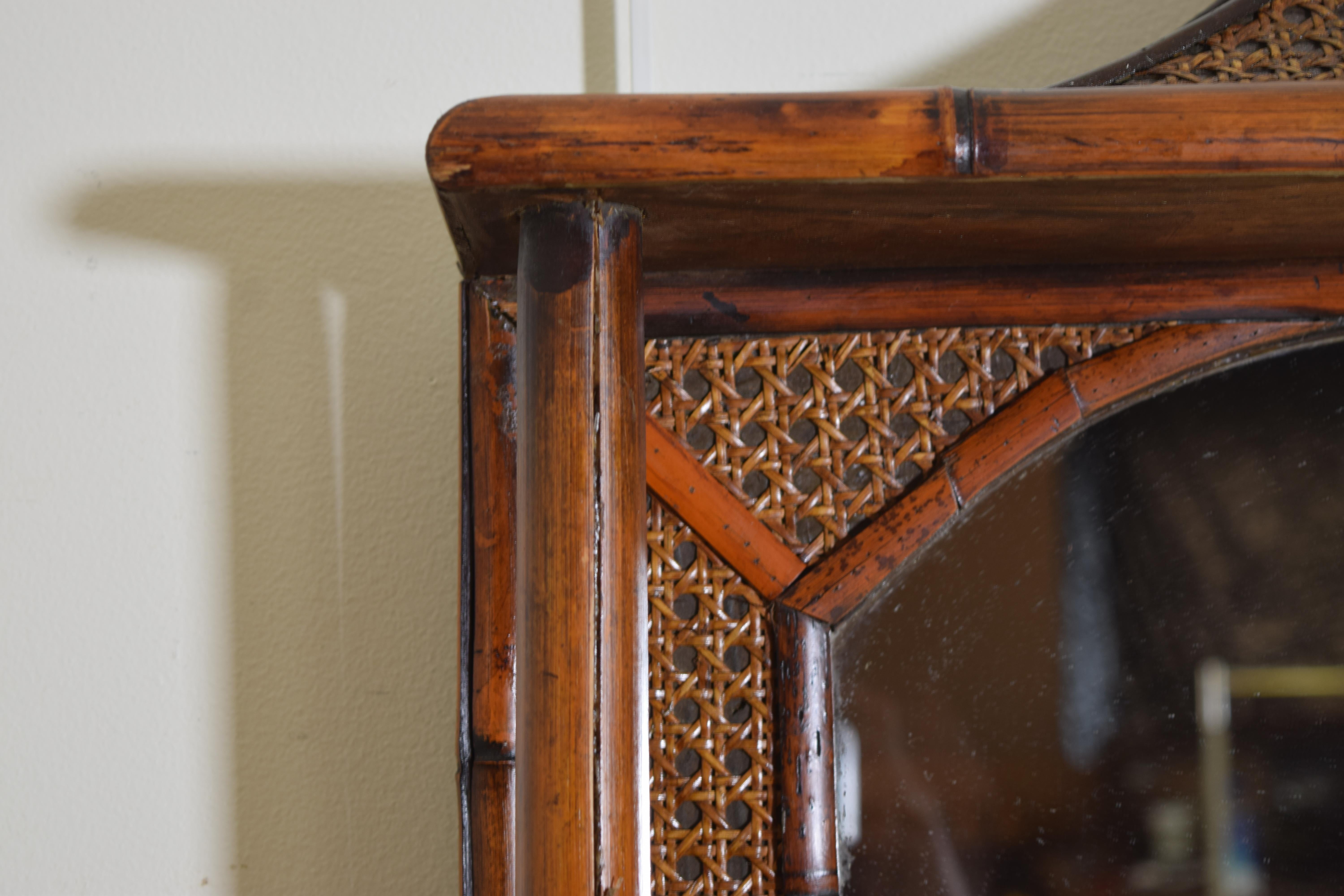 Early 20th Century English Rattan, Faux Bamboo, and Brass Pagoda Shaped Mirror with Storage Area