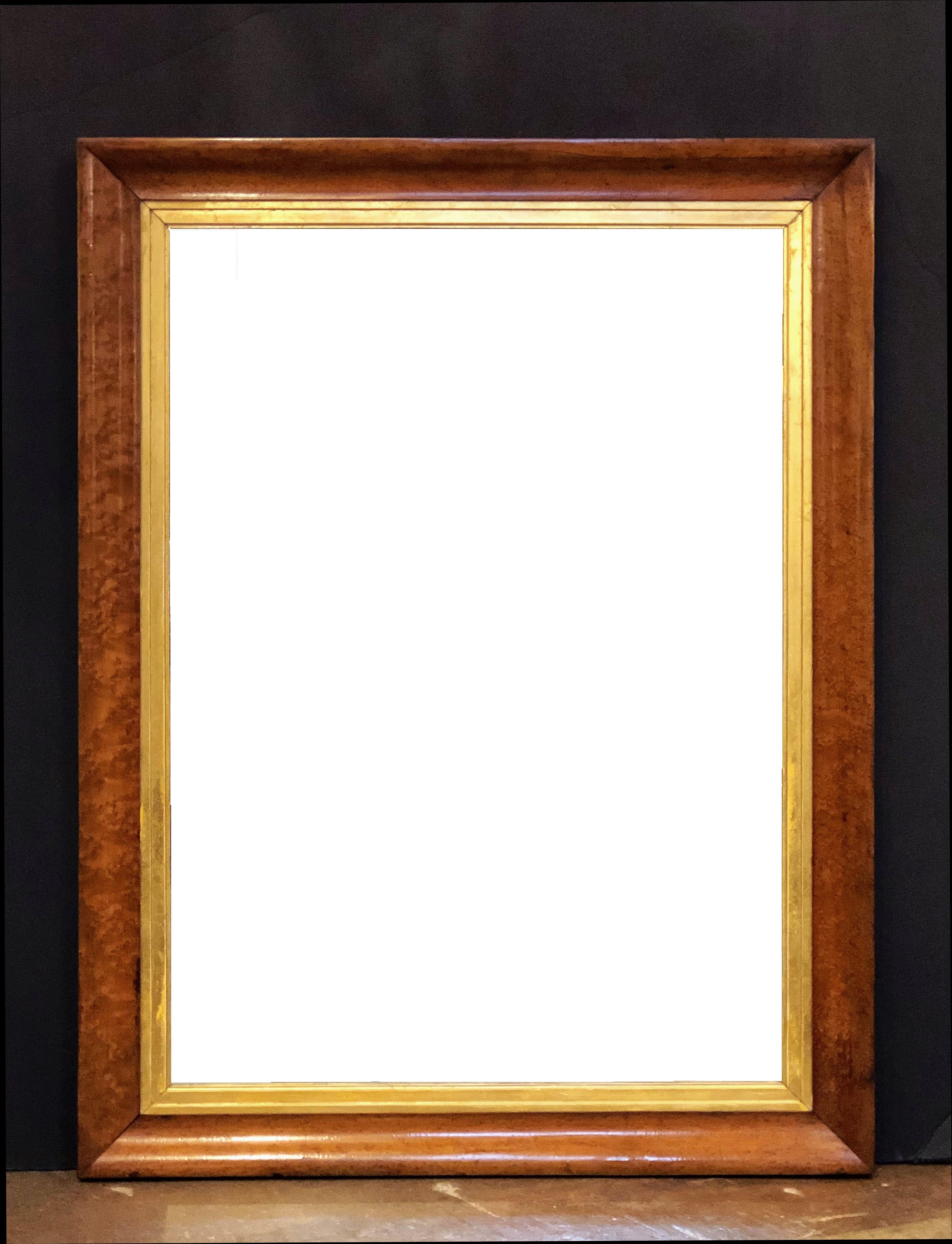 A fine English rectangular mirror featuring a bird’s-eye or curly maple frame with a gilt-wood 'slip' around the inner moulding.
Can be hung vertically or horizontally.

Dimensions: Height 41 3/4 inches x Width 31 7/8 inches x Depth 2 inches