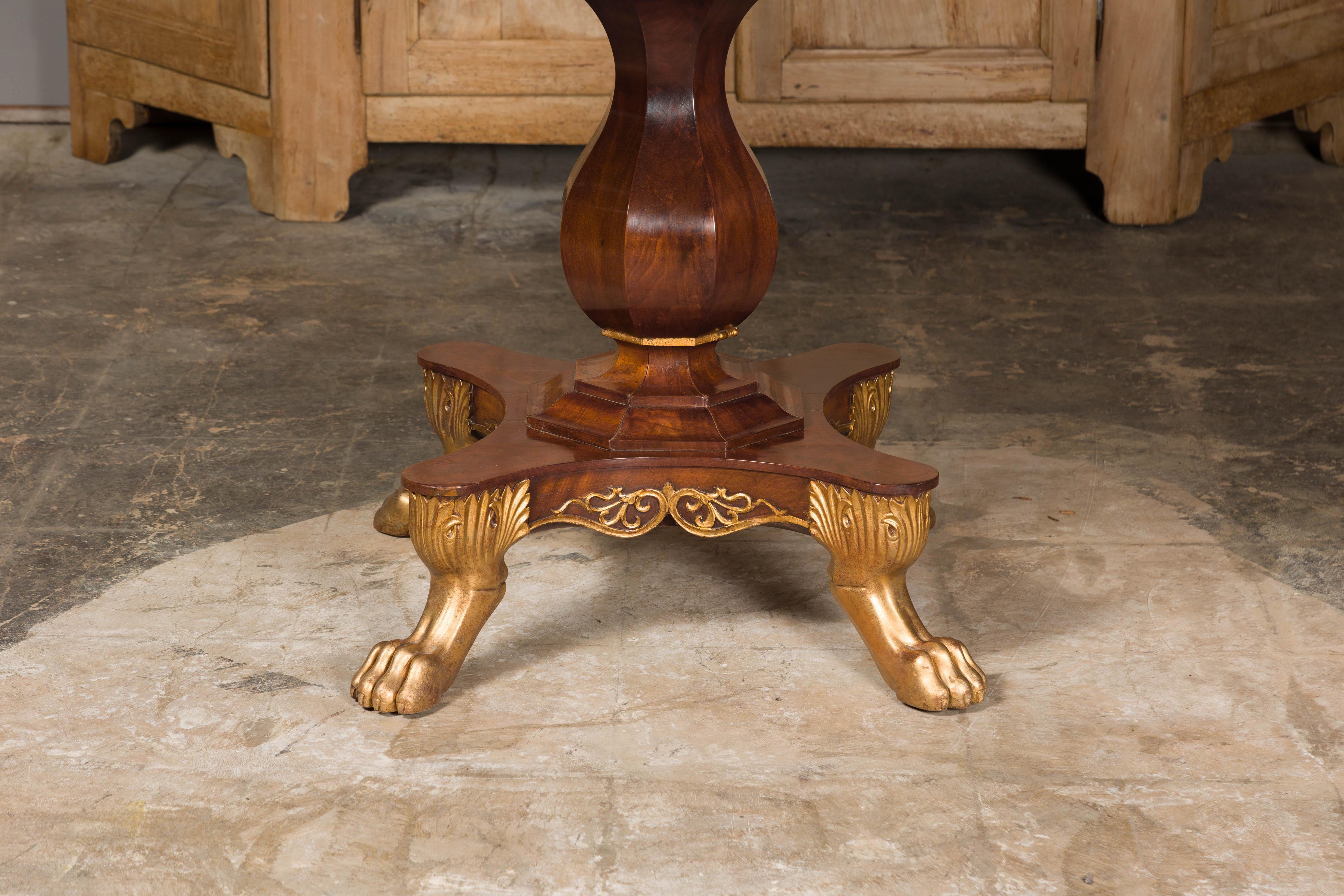 19th Century English Regency 1820s Mahogany Center Table with Octagonal Top and Gilt Paws For Sale