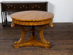 English Regency 19th Century Walnut Table with Carved Lion Heads and Tripod Base
