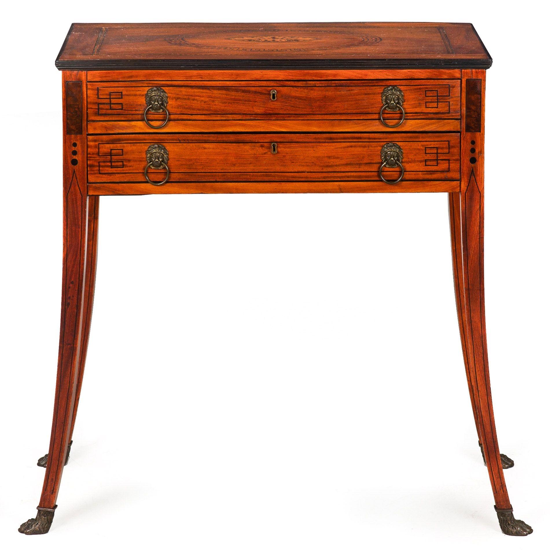 REGENCY INLAID SATINWOOD WRITING TABLE ON ANIMAL PAWS
England, ca. 1820
Item # 309JGP22Q
The form of this table is incredibly compelling and eye-catching, the legs featuring an exaggerated outward splay that far outpaces the boundaries of the