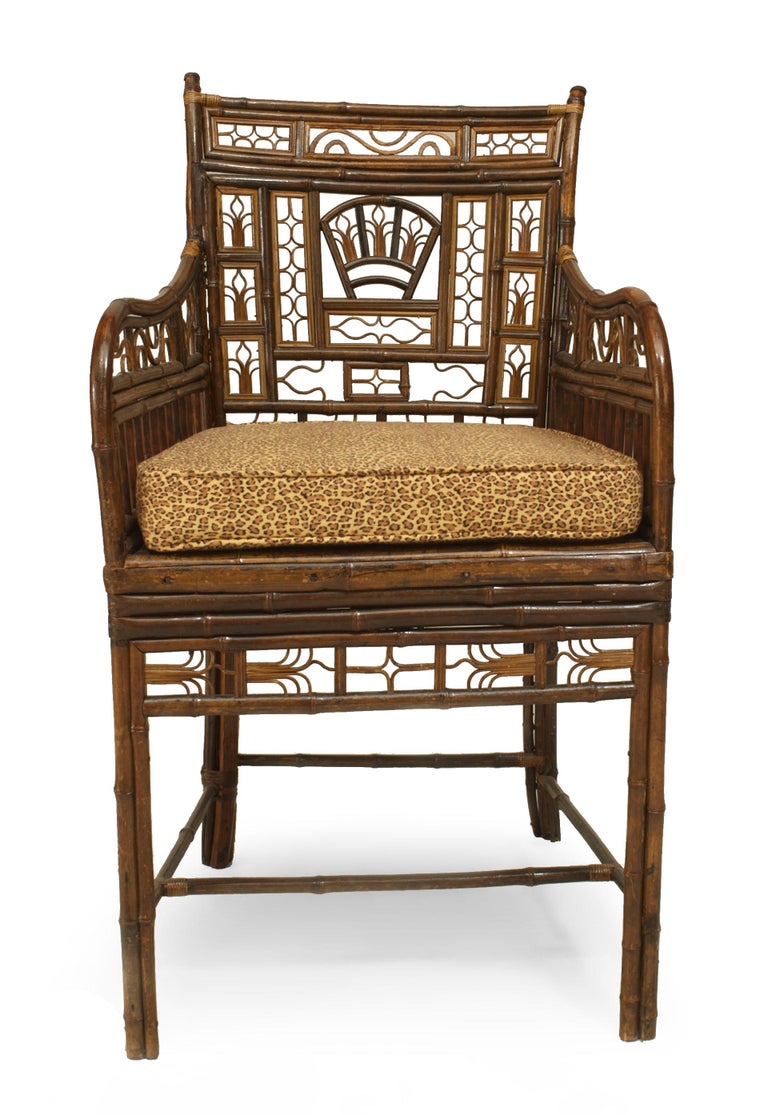 English Regency Brighton design bamboo arm chair with filigree design on back and arms with a cane seat under a cushion and a stretcher (similar to Inv. #036706D)
