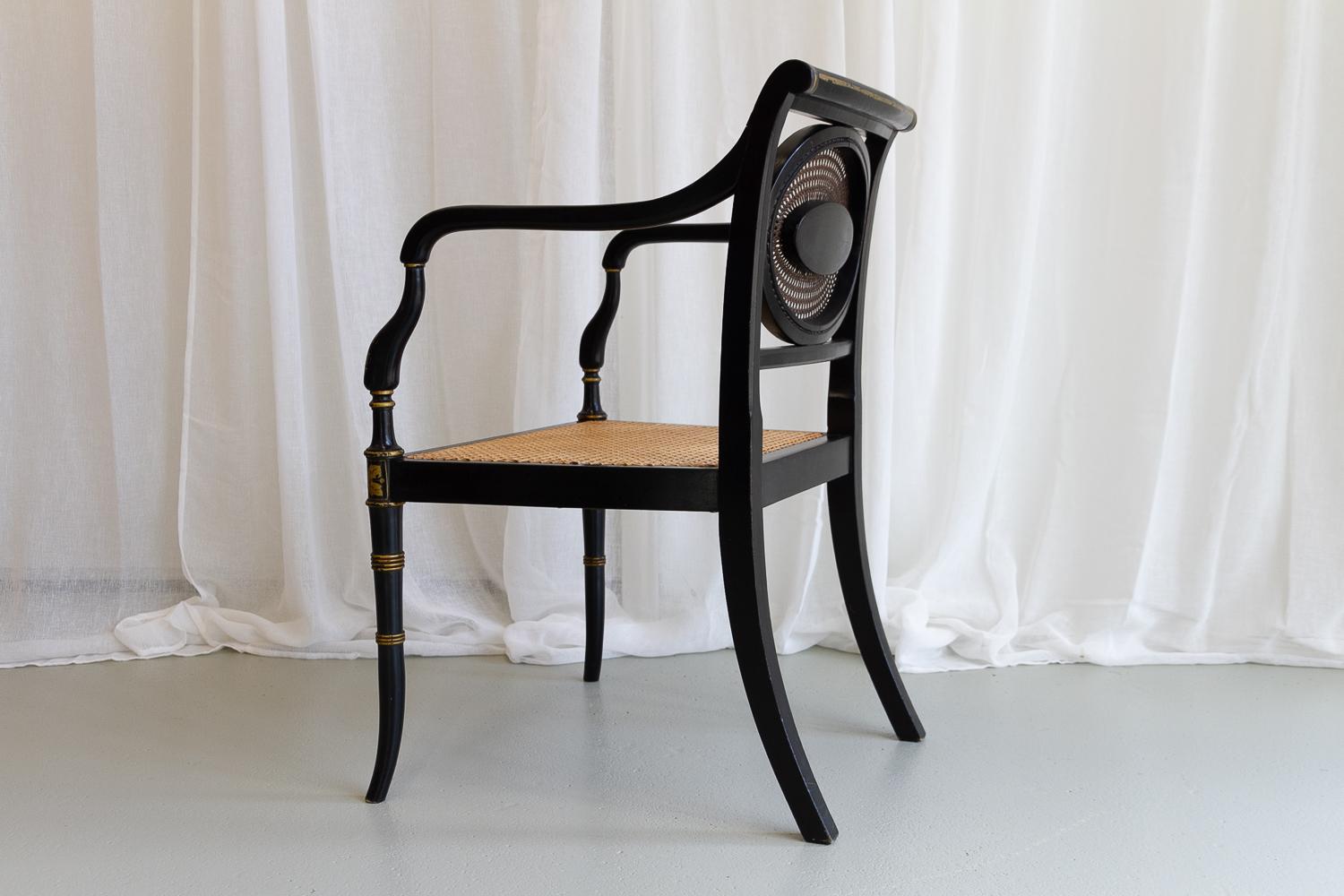 Cane English Regency Black and Gold Armchair, 19th Century. For Sale