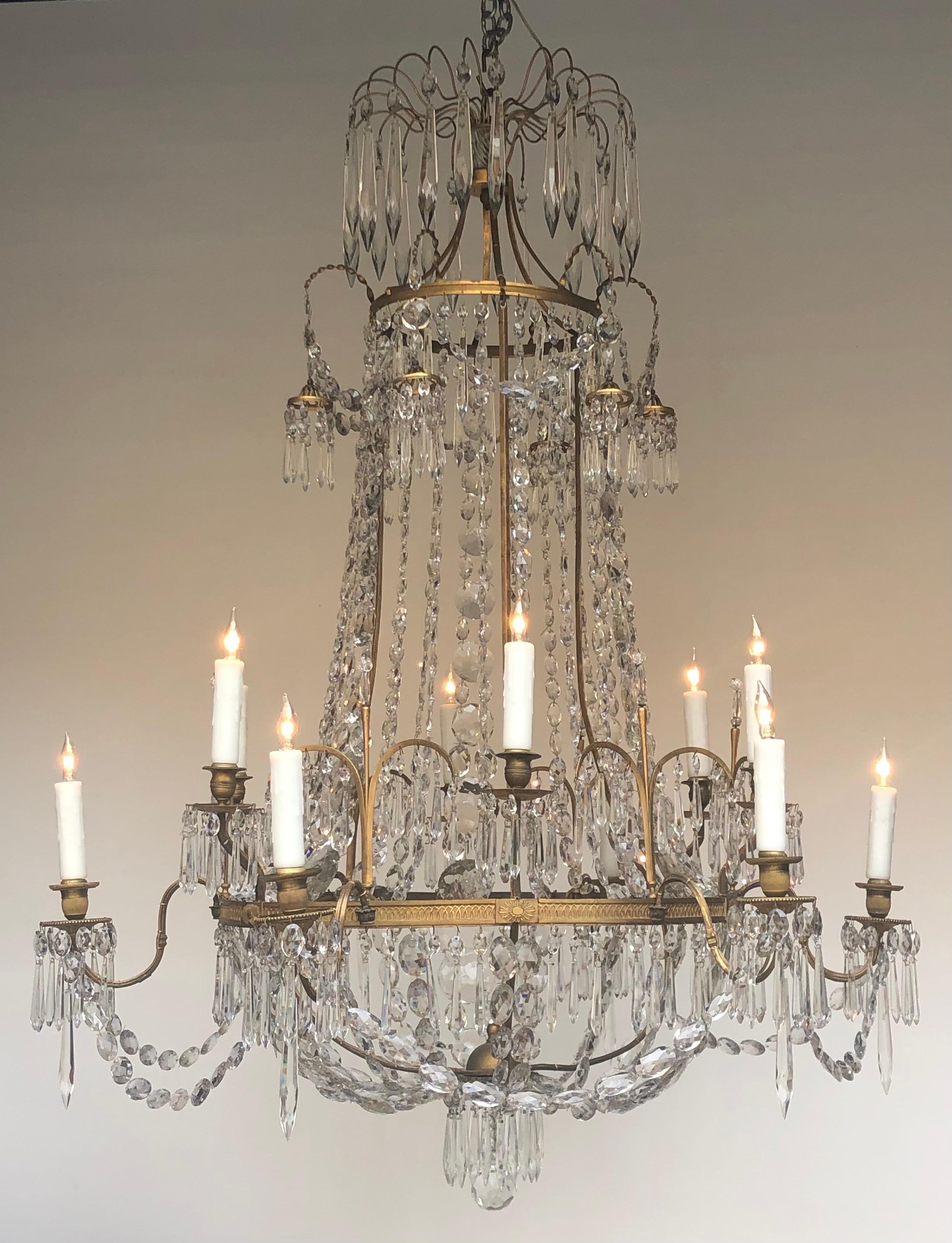 This Grand Elegant Regency Tent-&-Basket Twelve Candle Chandelier was designed and made in England in the early Nineteenth Century.  This Regency Period Chandelier has an elegant classical design. The Regency Tent-&-Basket Candle Chandelier has a