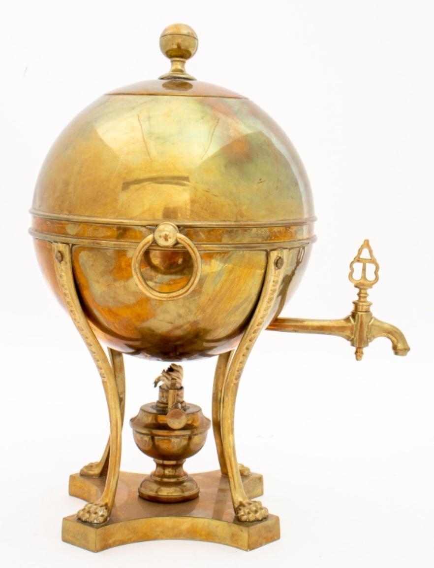 English Regency Brass Hot Water urn, samovar, or spirit heater, of spherical form on four legs with lions feet, on conforming plinth, apparently unsigned, but in the manner of Grieves, London. Slight dent on lid. Overall in good antique condition.
