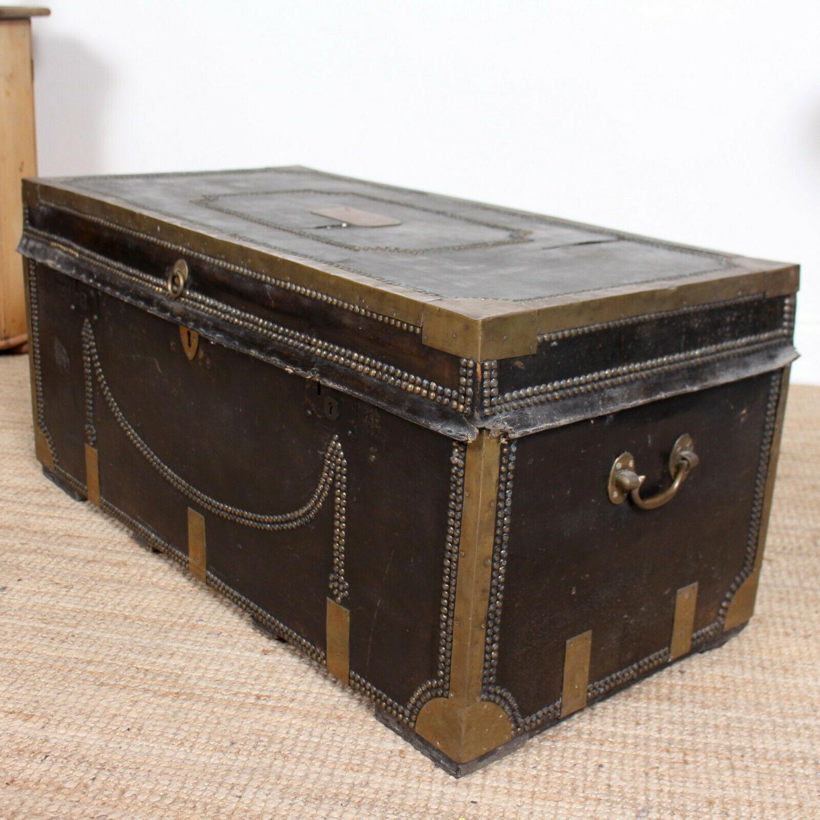 A magnificent Regency period leather bound camphor wood chest with original brass studded decoration and brass drop carry handles.

England, circa 1820.
  