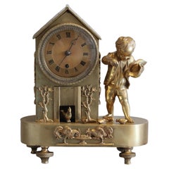 English Regency Bronze Arcadian "Genre" Mantel Clock of Boy Feeding Chickens