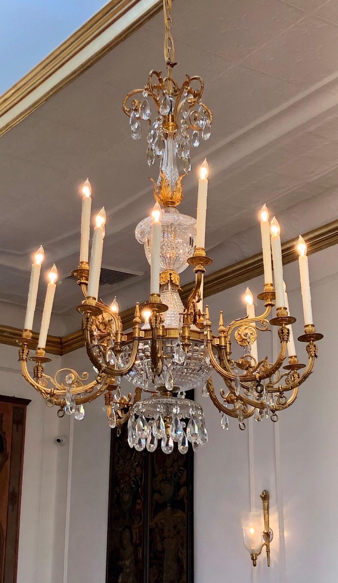 Monumental English Regency Gasolier has bronze doré gas arms with individual gas cocks on each arm. The chandelier has an hand-cut Irish crystal center stem in basket and vase form. The bronze doré & crystal chandelier is exquisitely decorated with
