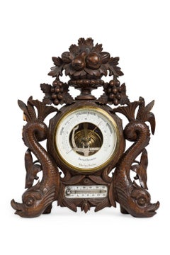 Barometro inglese Regency in legno di noce intagliato Barometro inglese Regency in legno di noce intagliato