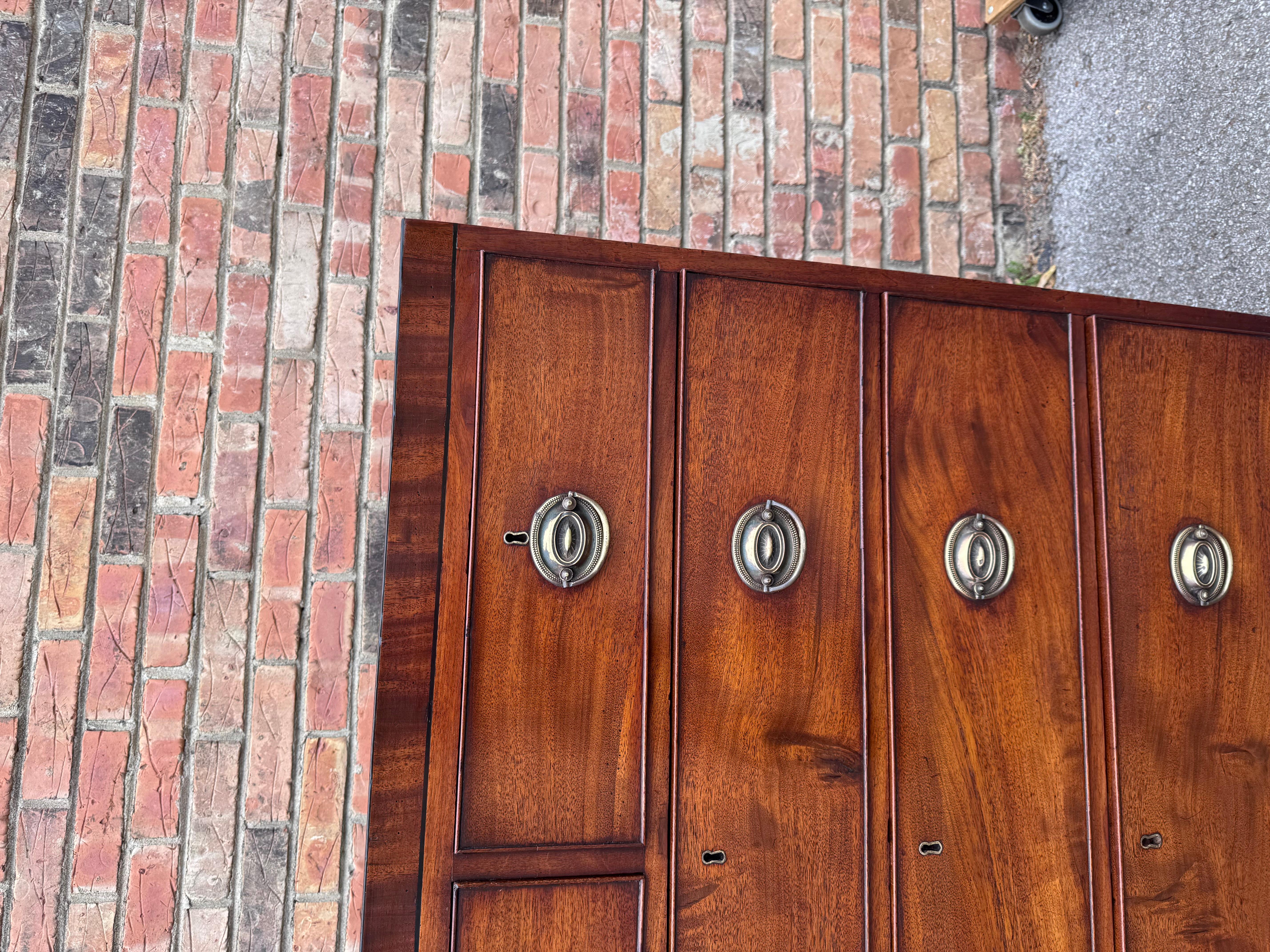 This 19th century English Chest of Drawers is a beautifully designed piece of furniture, featuring a caddy top tastefully tapered legs, lovely drawer fronts and vintage brass Hepplewhite pulls.. It showcases excellent craftsmanship and is made from