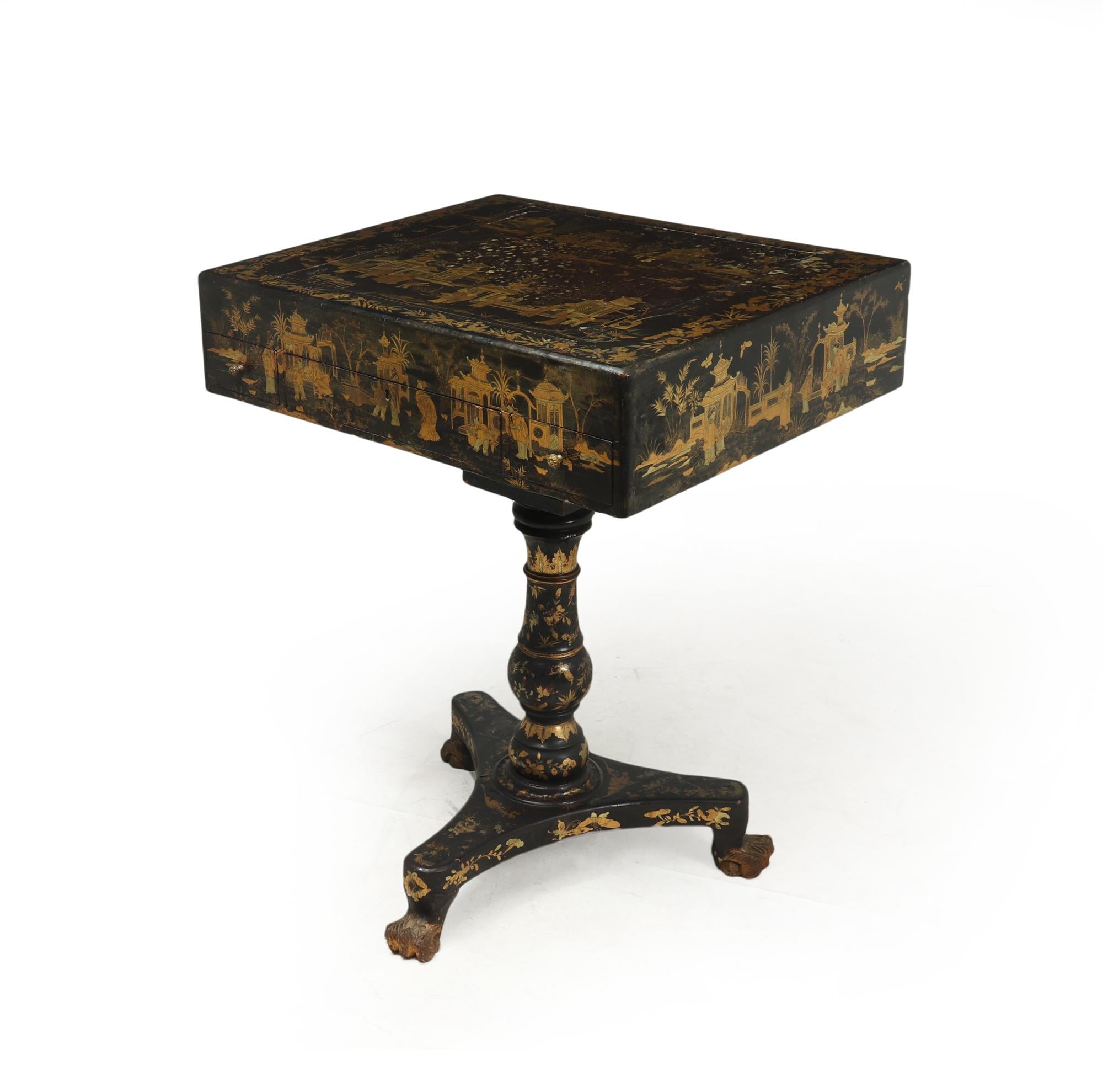 A very well preserved English Regency Chinese export games and side table with black lacqure and gold leaf chinoiserie, flip over center to reveal back gammon and chess board, detatcable top with ‘bird cage’ fitting, this games table would have been