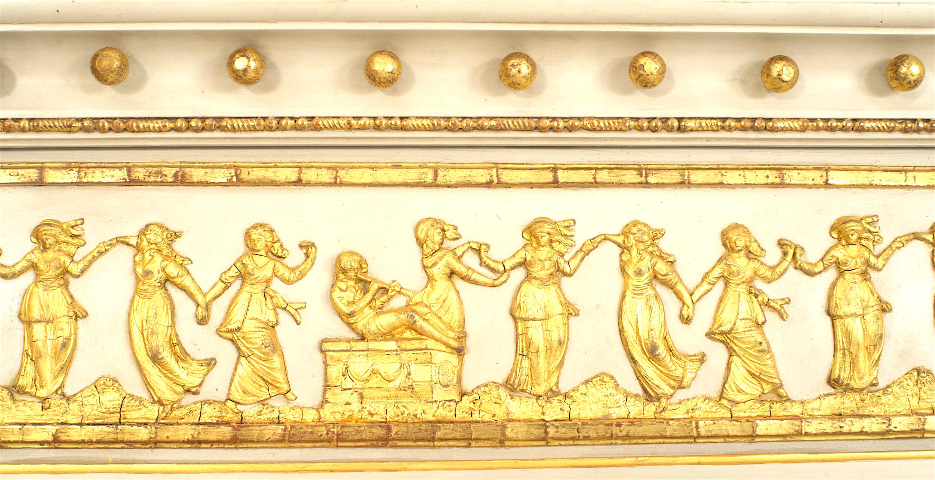 English Regency-style horizontal cream painted and gilt trimmed three-section wall mirror with fluted column pilaster sides under classical heads and a relief of dancing figures.
