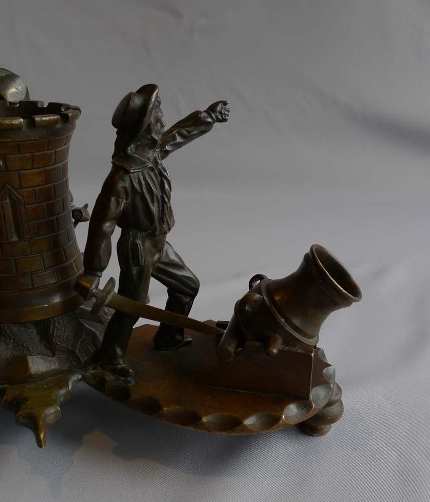 An extremely rare and very unusual bronze desk set in the form of British sailors ( or Jack Tars) defending or more likely attacking a fort with mortars. Set on bun feet with what appears to be an inkwell in the form of a castellated fort in the