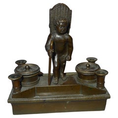 Ecrier inglés de la Regencia y cerillero de bronce patinado