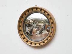 English Regency Giltwood Convex Mirror with Ebonized Ball Accents