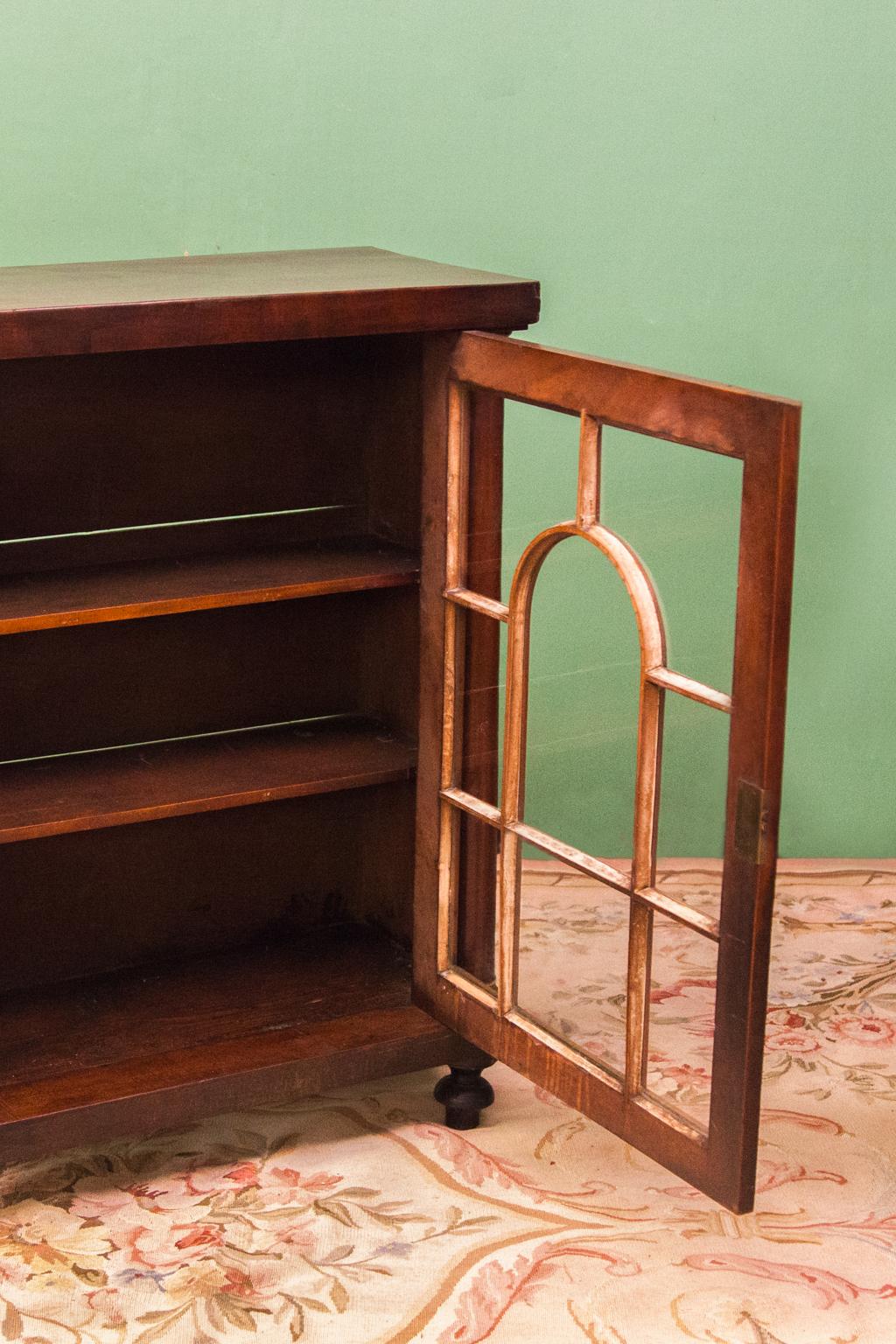 small antique bookcase with glass doors