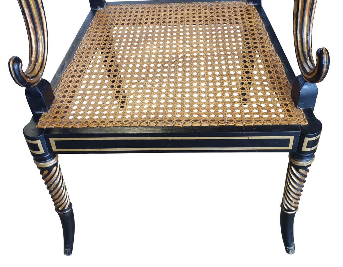 19th century English Regency side chair.
Greek key design.
Gold leaf decorative details.
Cane seat.
 