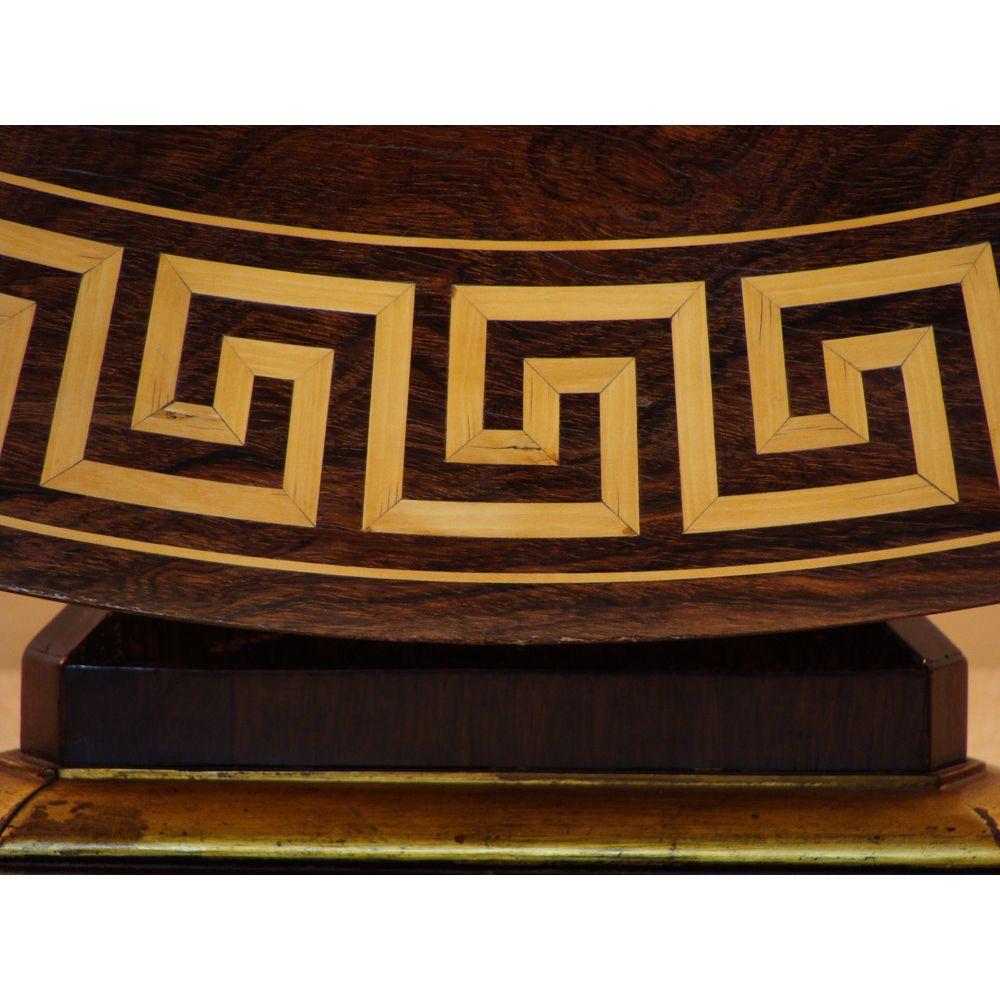 A high quality English Regency inlaid rosewood centre table inlaid with “Greek Key pattern” border. 

This design of English Regency inlaid rosewood centre table rarely has this extremely high quality and complex ‘Greek Key’ pattern satinwood