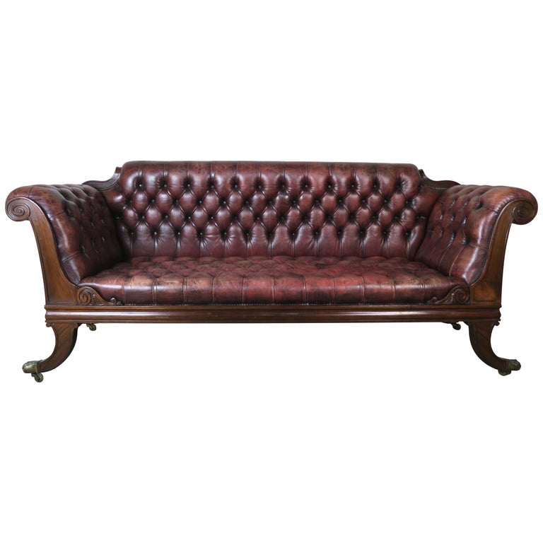 Brown leather tufted sofa