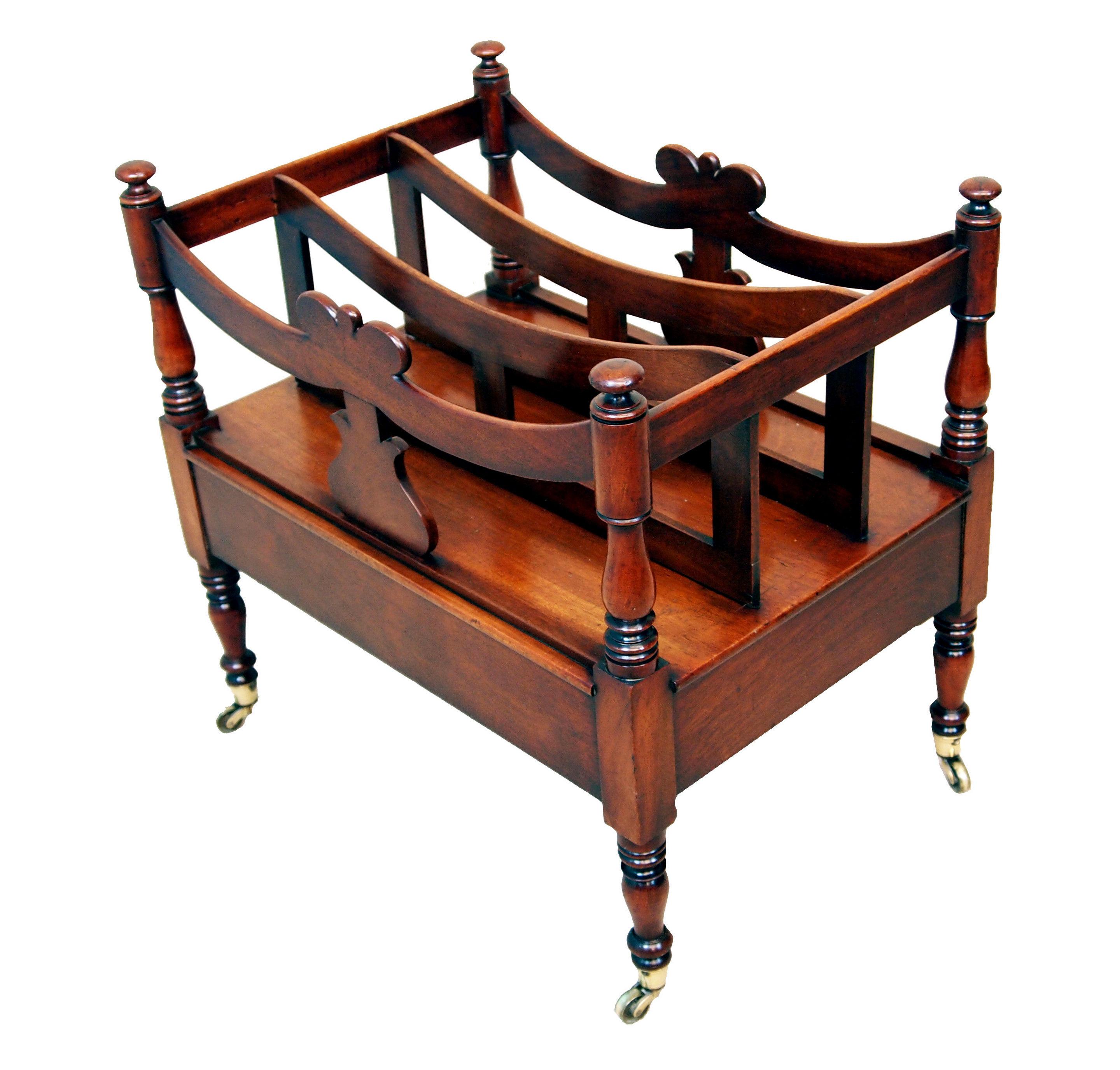19th century (Regency Period, 1820s) English mahogany canterbury. It is boat shaped with its silhouette upright supporting the dividers above one frieze drawer with turned legs on its original casters. These objects are called canterburies because